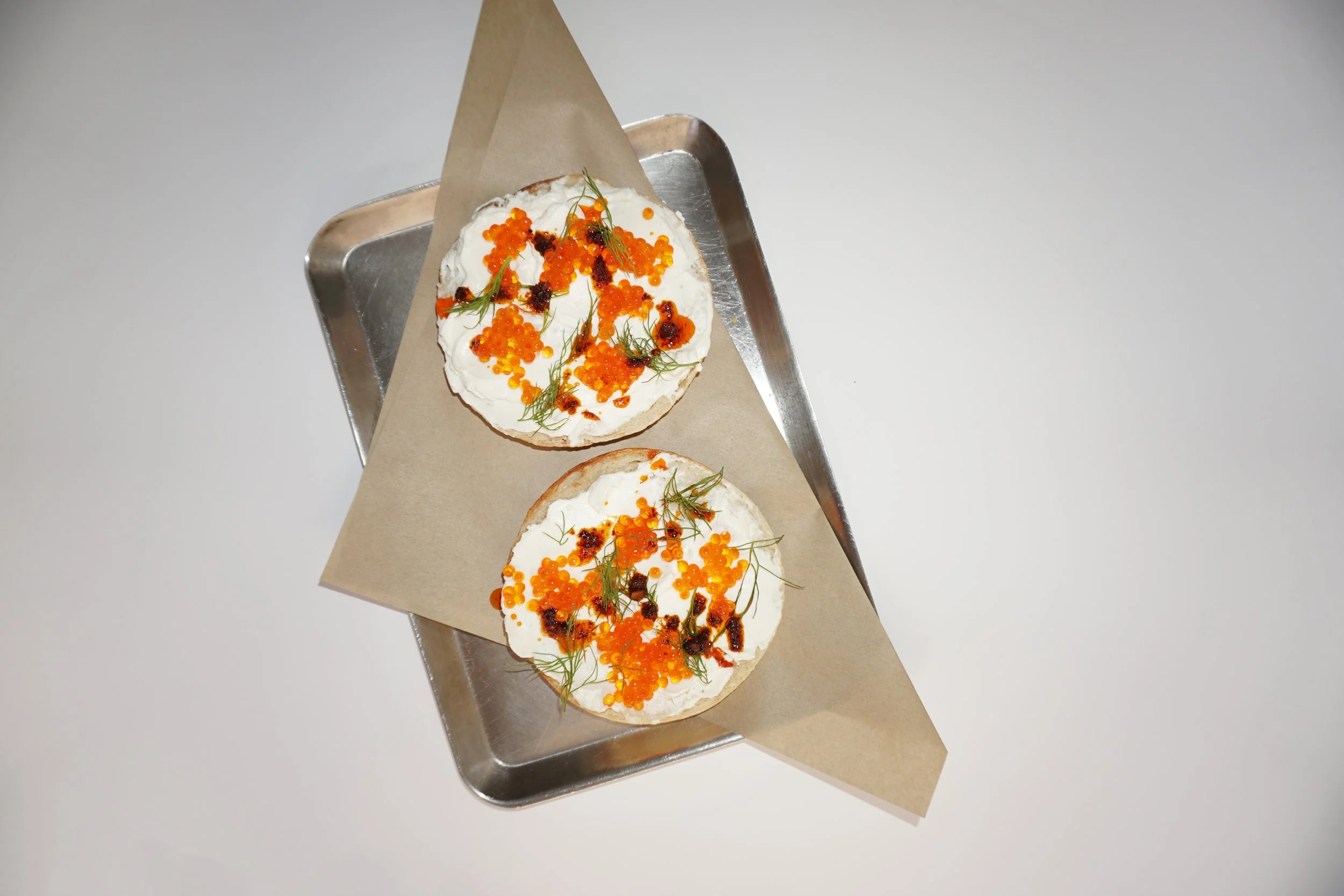 Colorful Aesthetic Trout Roe and Chili Crisp Bagel from Rhodo Bagels- the Best Bagels in Lisbon Time Out