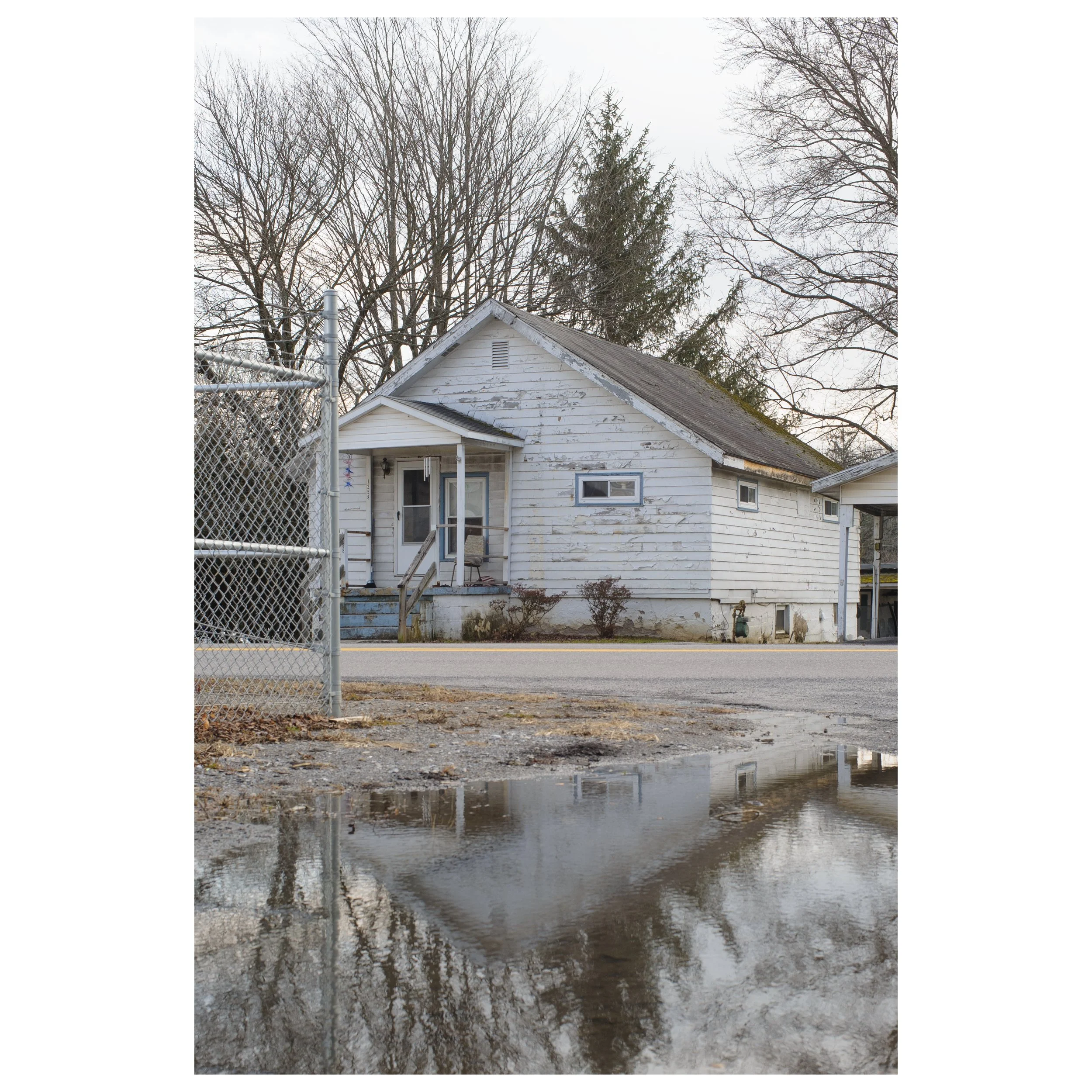 Refraction of the Dream — Throughout its history, America has been an industrial powerhouse. As demand grows, industrialization increasingly encroaches on the American dream. The barbed fence on the left side of the frame, representing both physical 