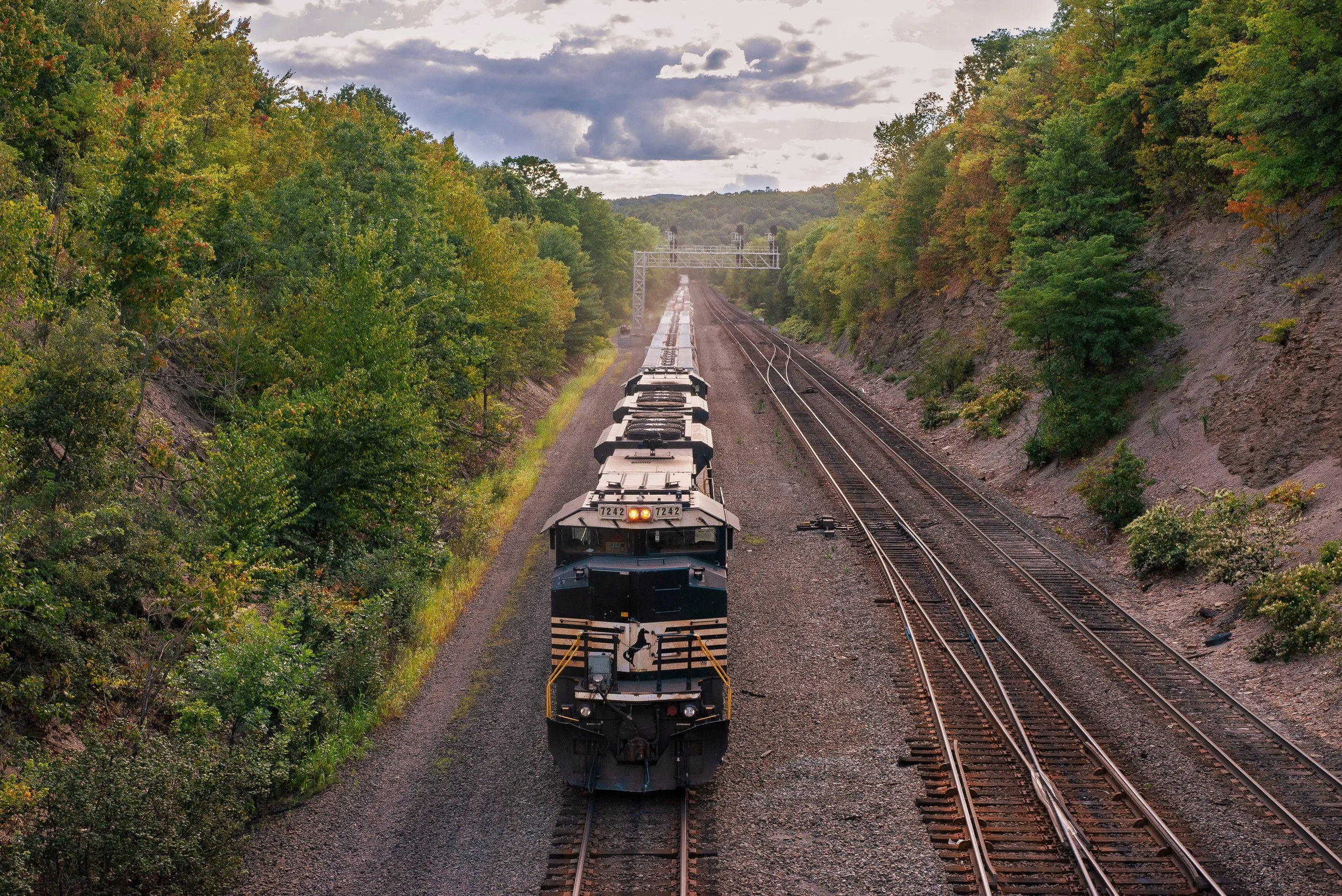 The Tracks That Carried a Nation — Through the quiet hills of Blair County, a train presses forward along rails that have carried generations before it. Captured in Altoona, this moment echoes with the sacrifice and dreams of those who built their li