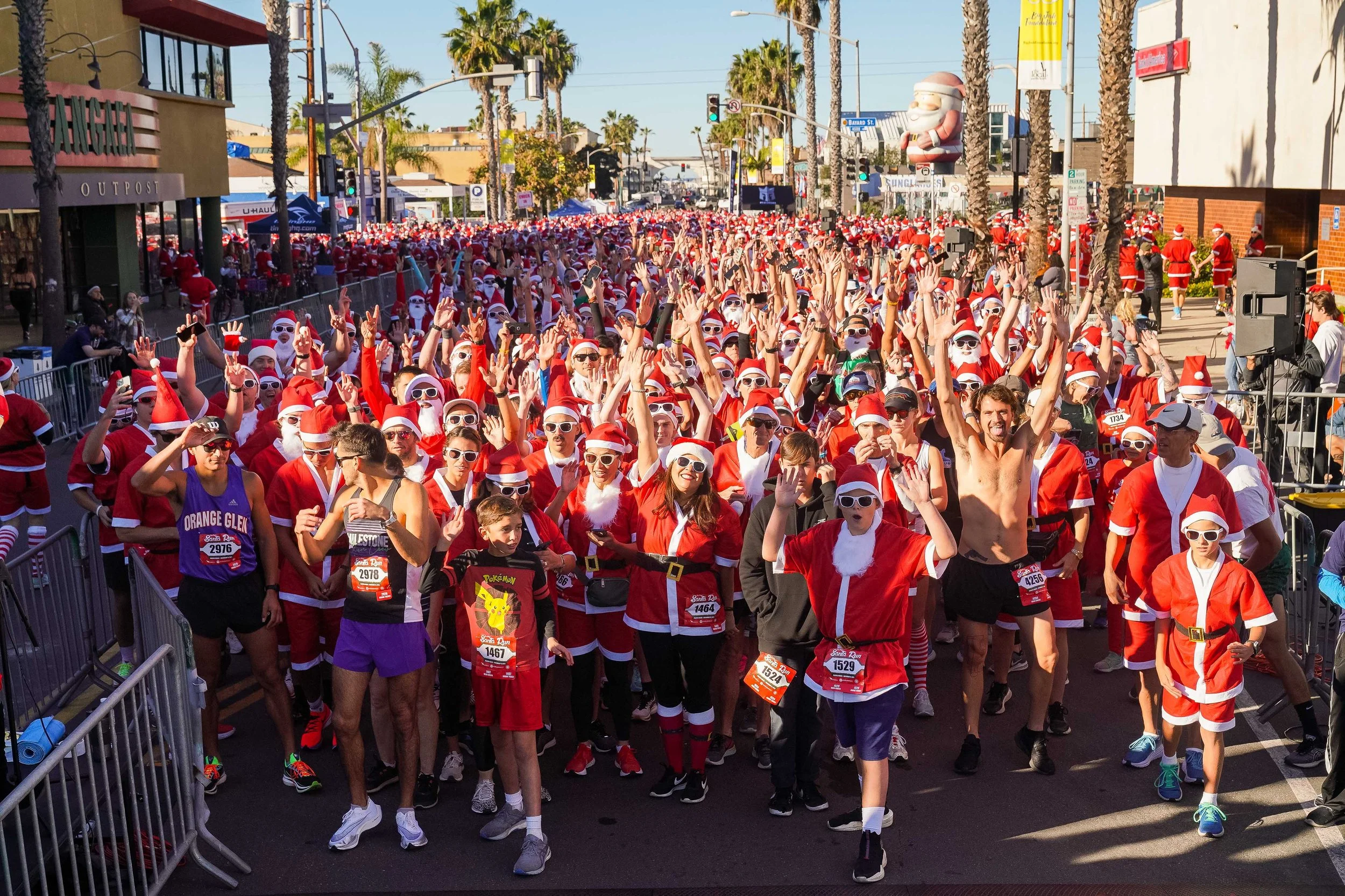 People dressed in Santa costumes for a fun run in San Diego.