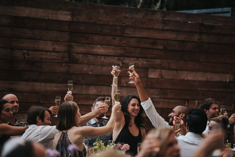 Guests toast at wedding held at The 1909 in Topanga.