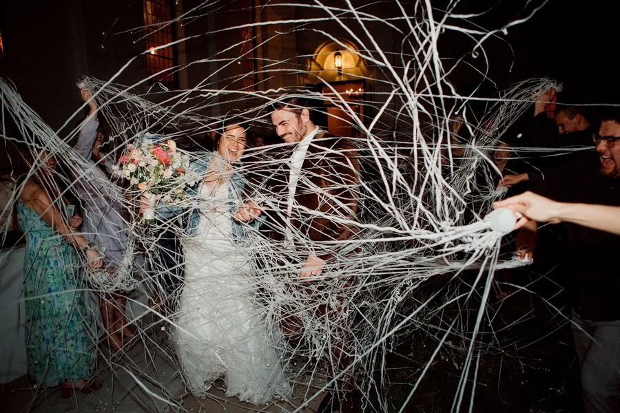 Happy couple exits their wedding reception in Los Angeles.