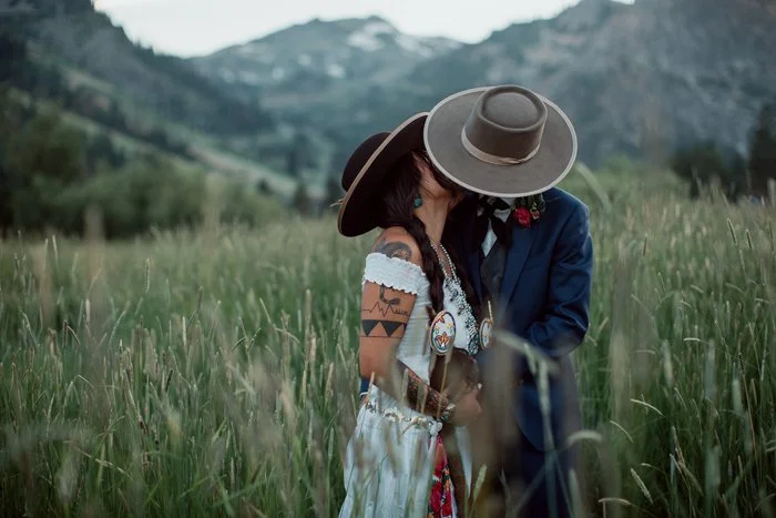 Bride and Groom kiss in a mountain valley at their Lake Tahoe wedding.