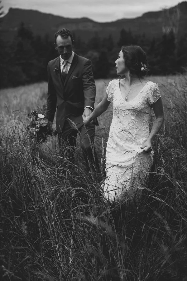 Bride and groom in field