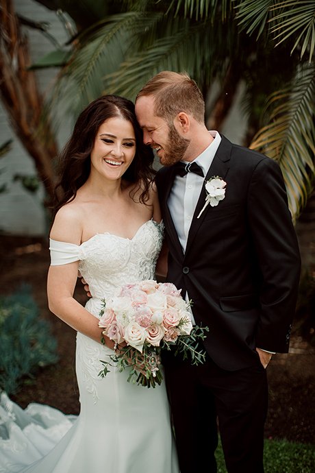 Couple poses for photos in Balboa Park after their San Diego Courthouse wedding.