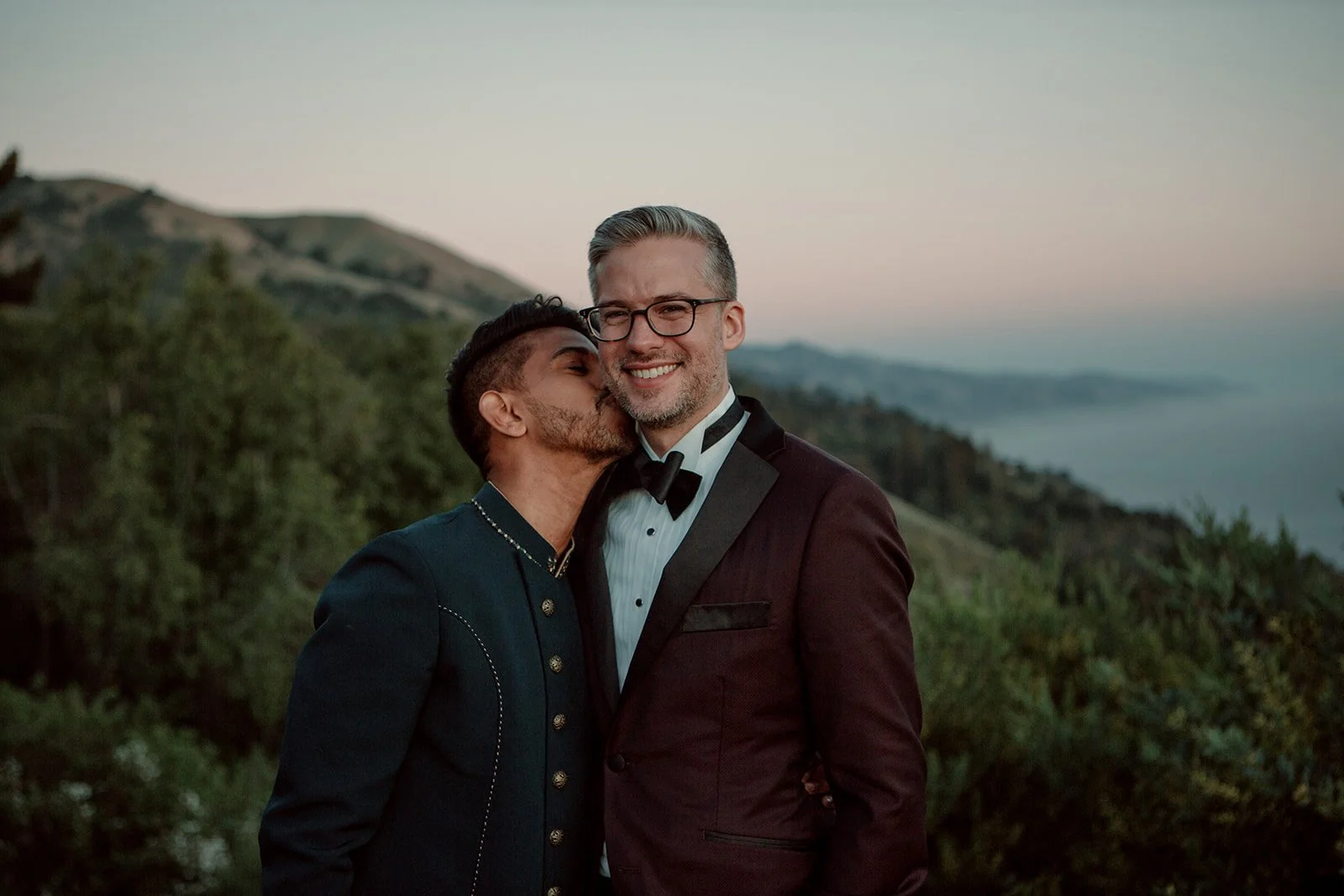 Man kisses his groom for their San Diego elopement wedding.
