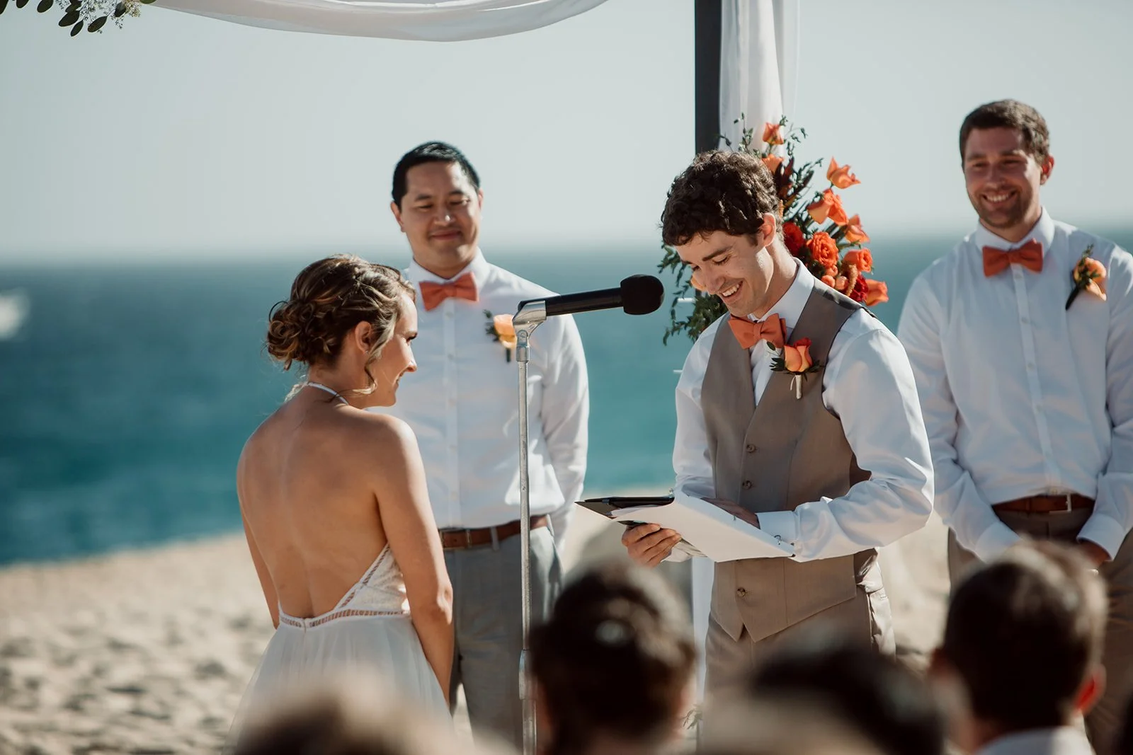 Groom reads his vows during a San Diego beach wedding celebration.