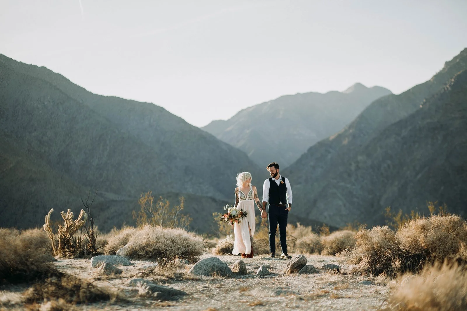 San Diego elopement couple has their photos taken in front of mountains.