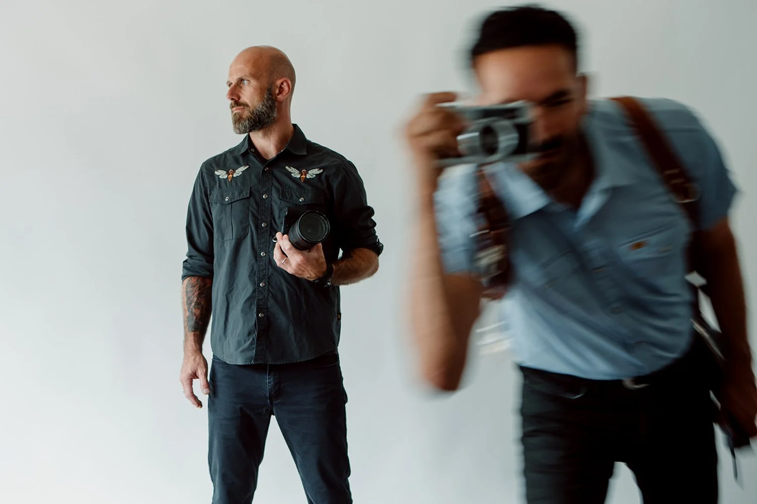 San Diego wedding photographers Simone and Daniel on a while background.