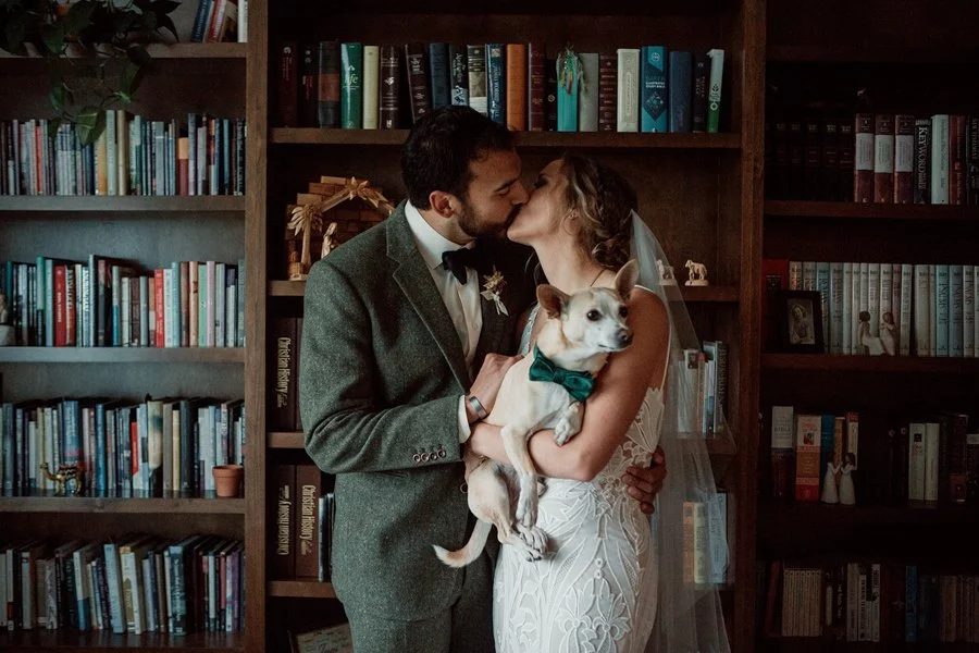 A couple kisses in their house during a first look at their San Diego wedding. San Diego wedding photography.
