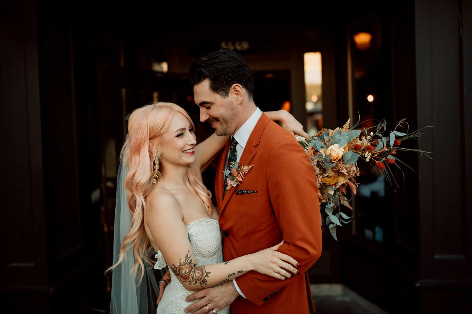 San Diego courthouse wedding photos in the Gaslamp of a couple laughing.