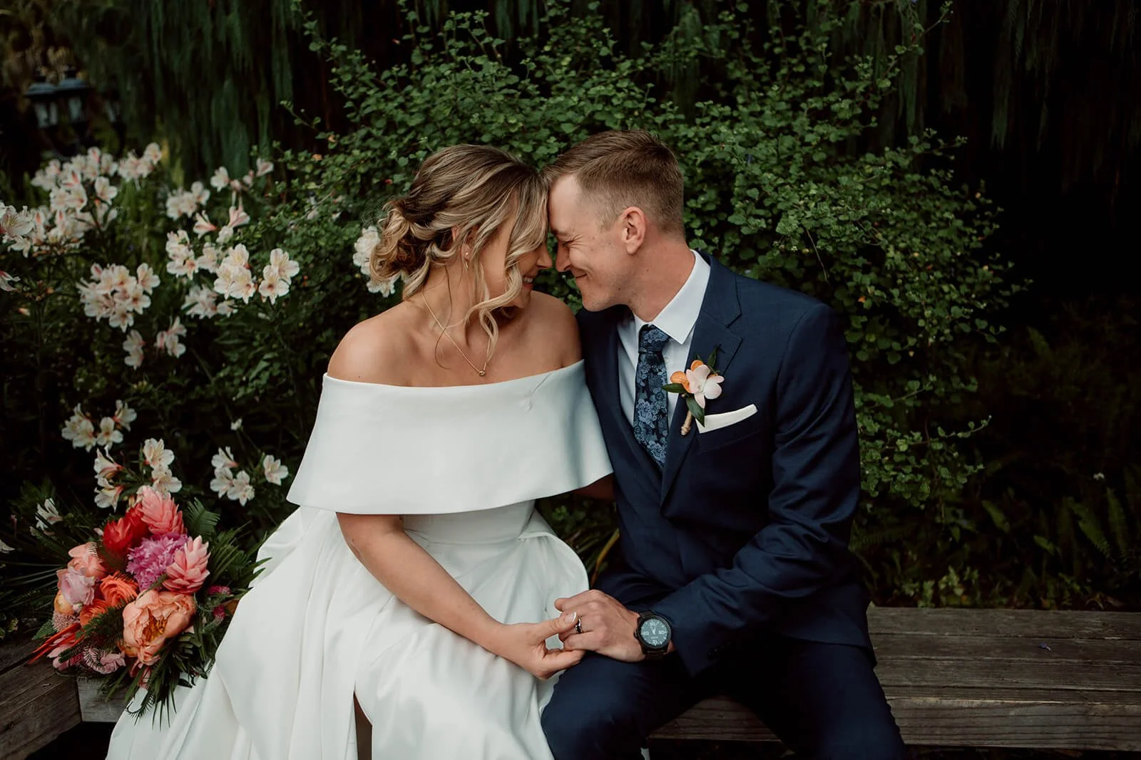 San Diego wedding photography, bride and groom sit together at San Diego Botanical Gardens.
