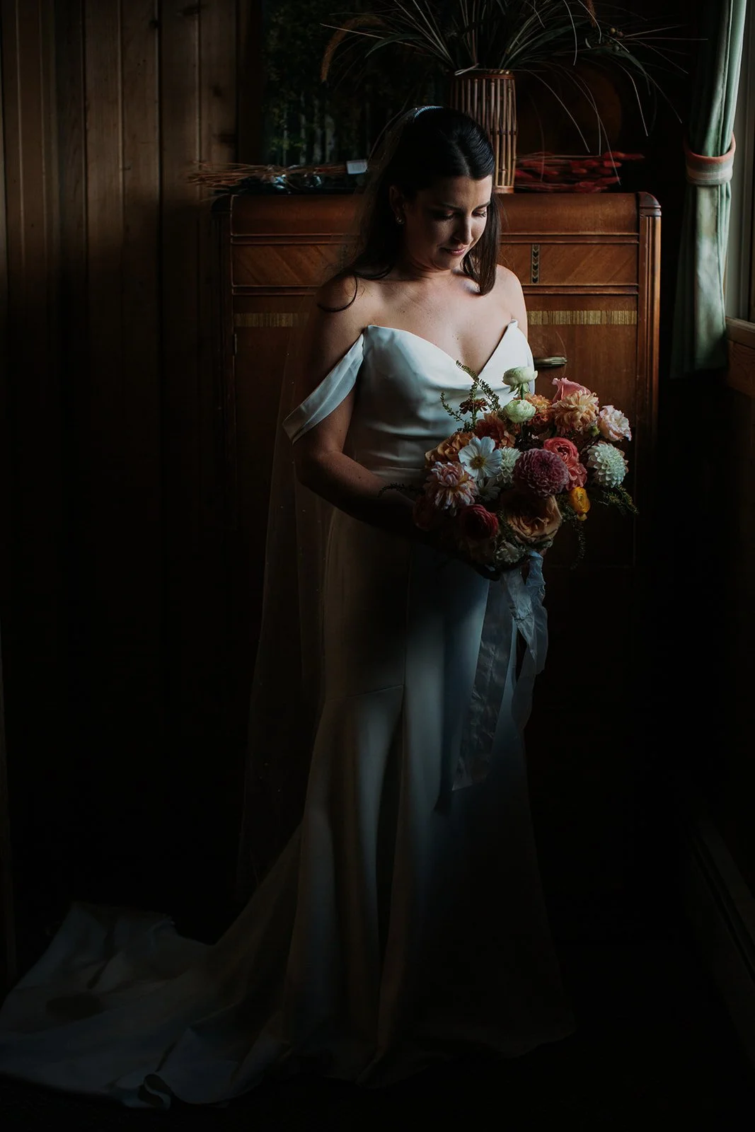 Bride takes a moment alone in her bridal suite before starting her wedding ceremony.