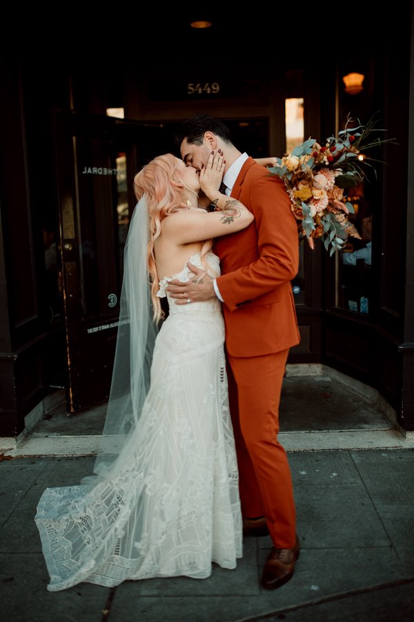 San Diego elopement wedding day photos of a couple kissing in the Gaslamp quarter.