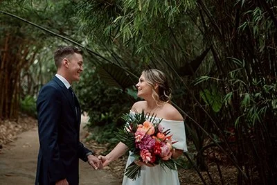 Couple share vows at the San Diego botanical garden for their wedding.