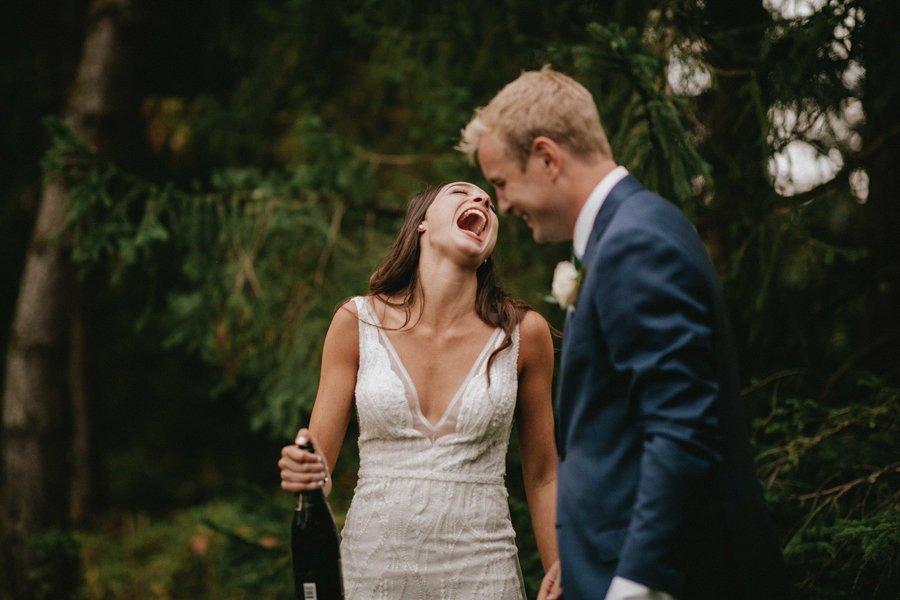 Bride and groom laughing after the wedding ceremony.