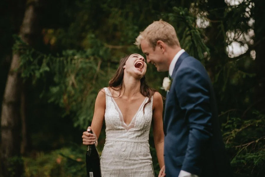 Bride and groom laughing after the wedding ceremony in San Diego..