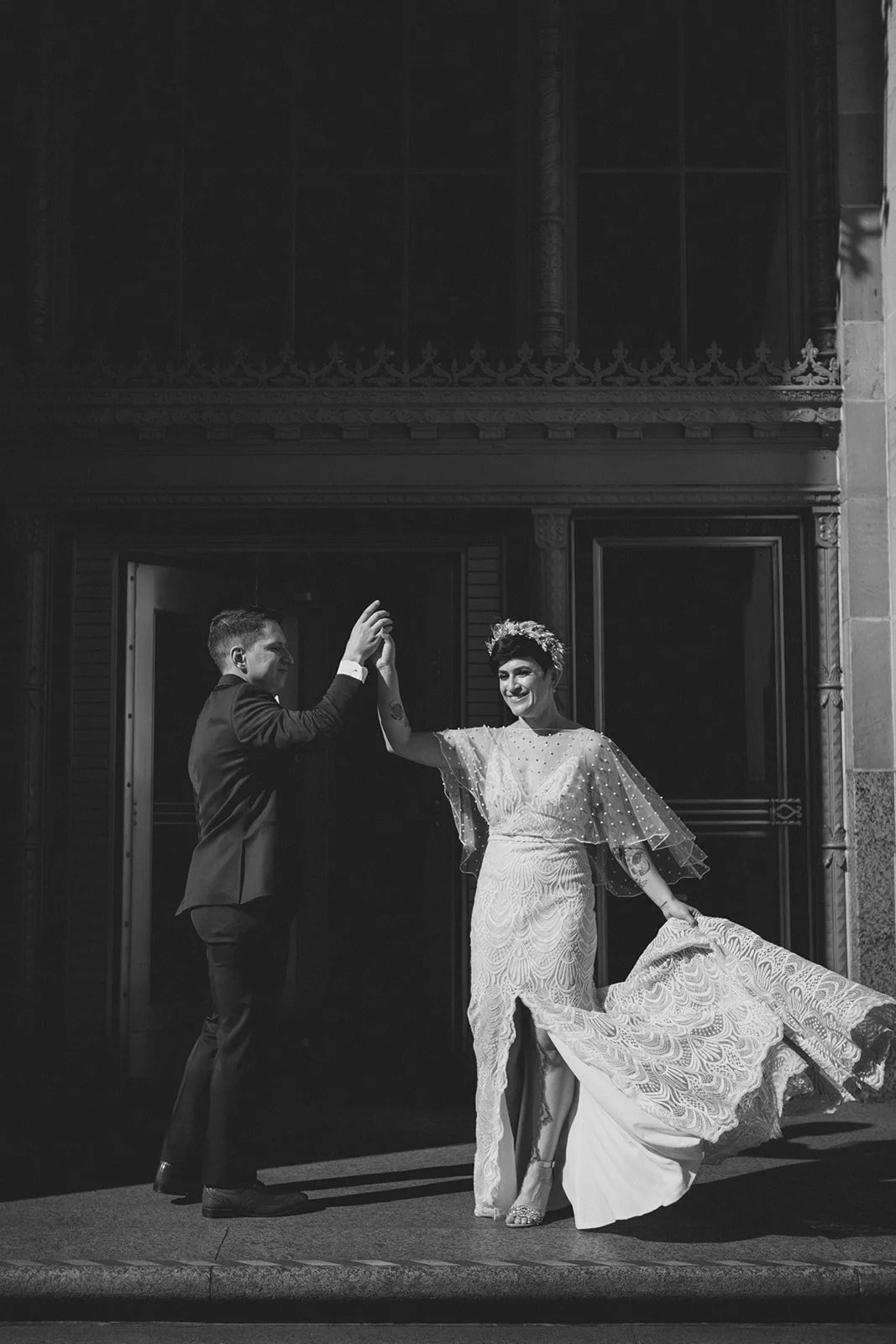 San Diego courthouse wedding photography. Couple pose for photos near the San Diego Courthouse.