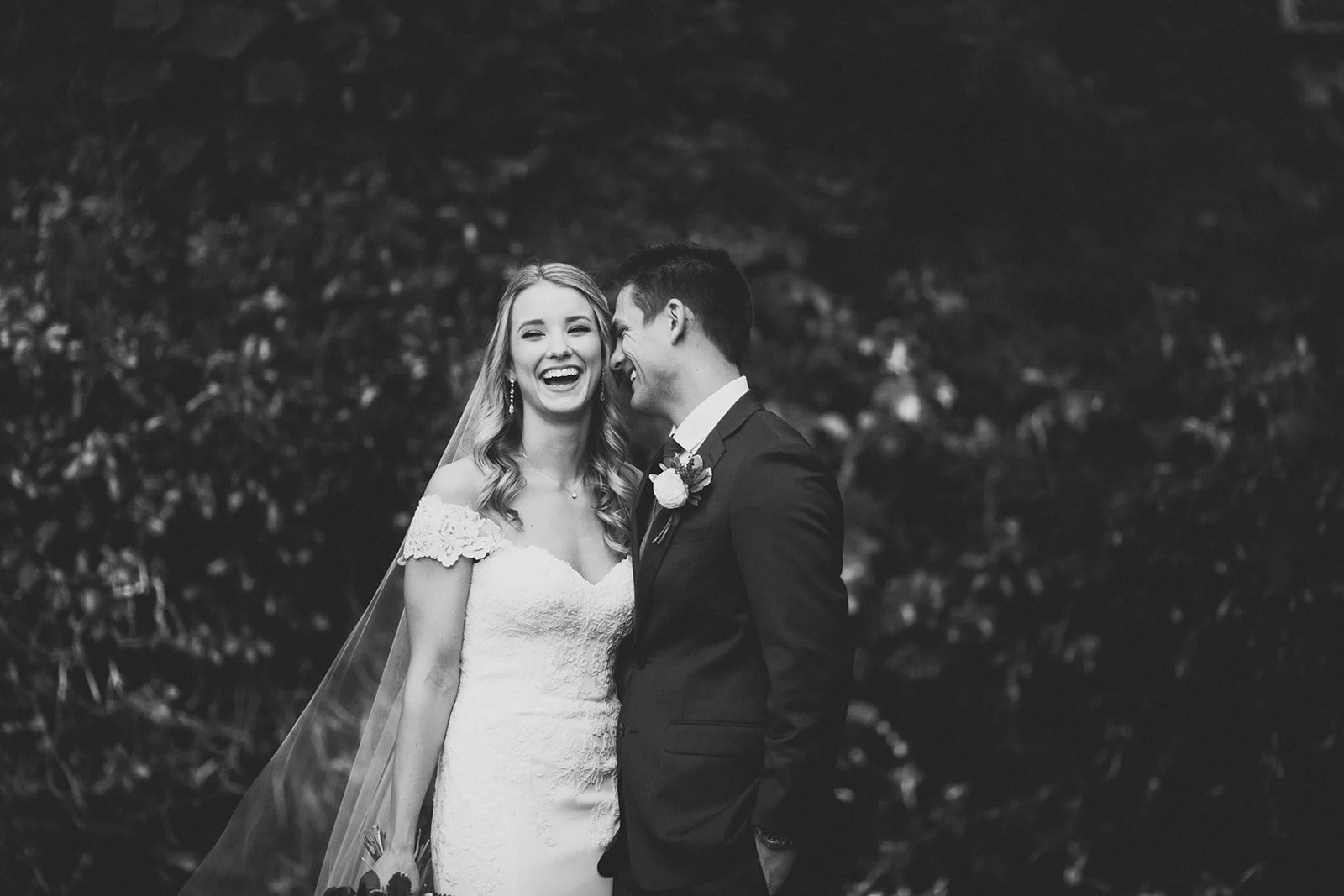 San Diego wedding couple laughs for photos.