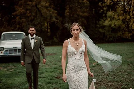 Beautiful bride walks with groom in east San Diego wedding. 