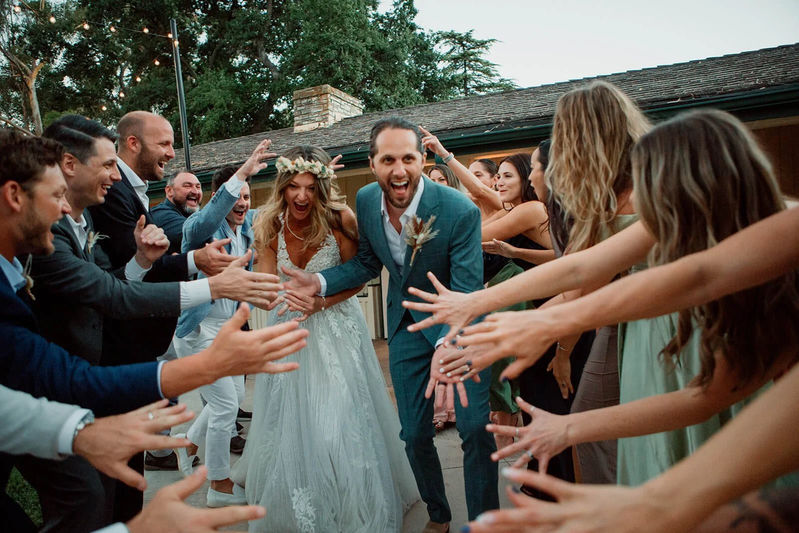 Wedding party cheers on a couple for their wedding in San Diego.