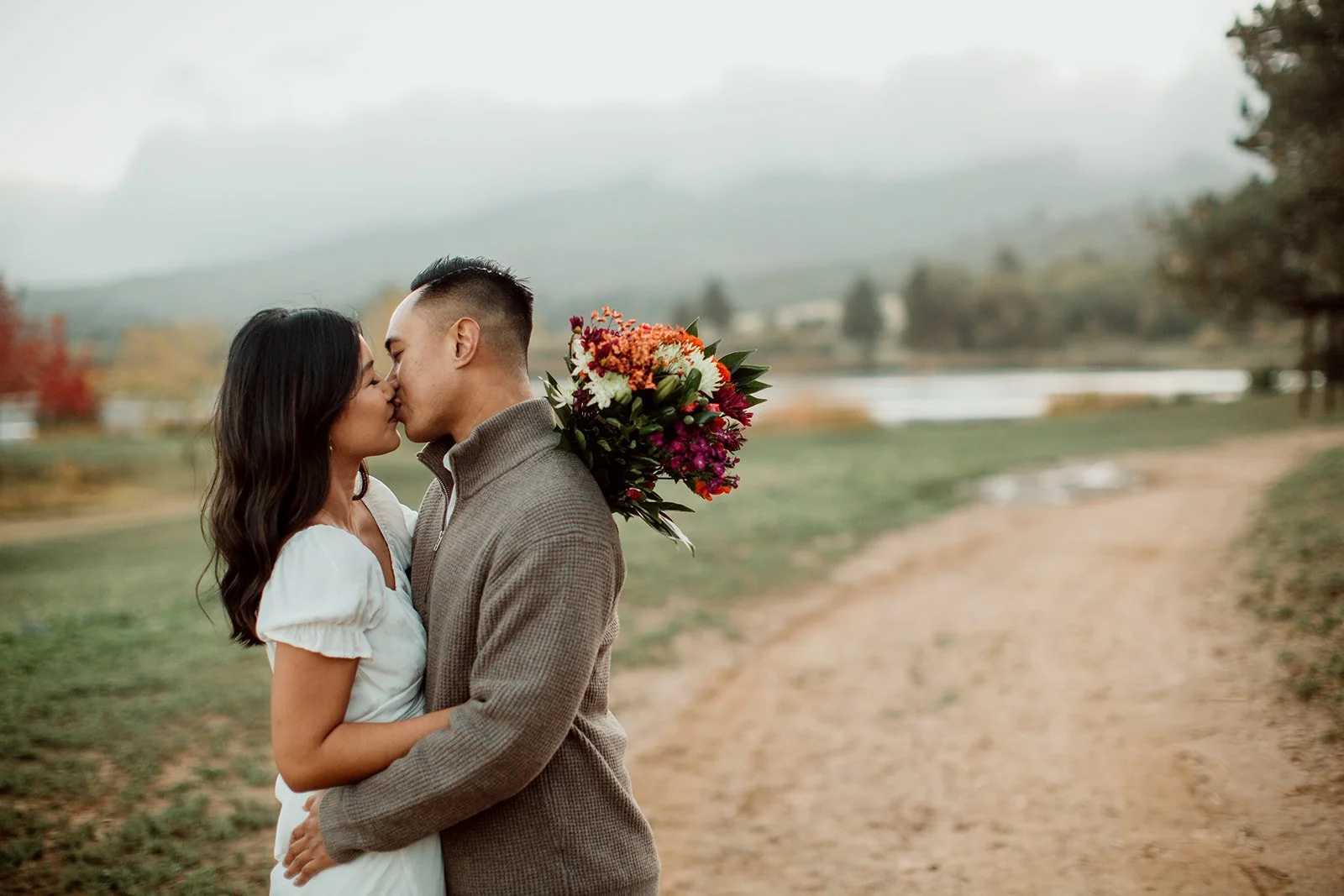 Engagement photos of a couple kissing out near Julian in San Diego county.