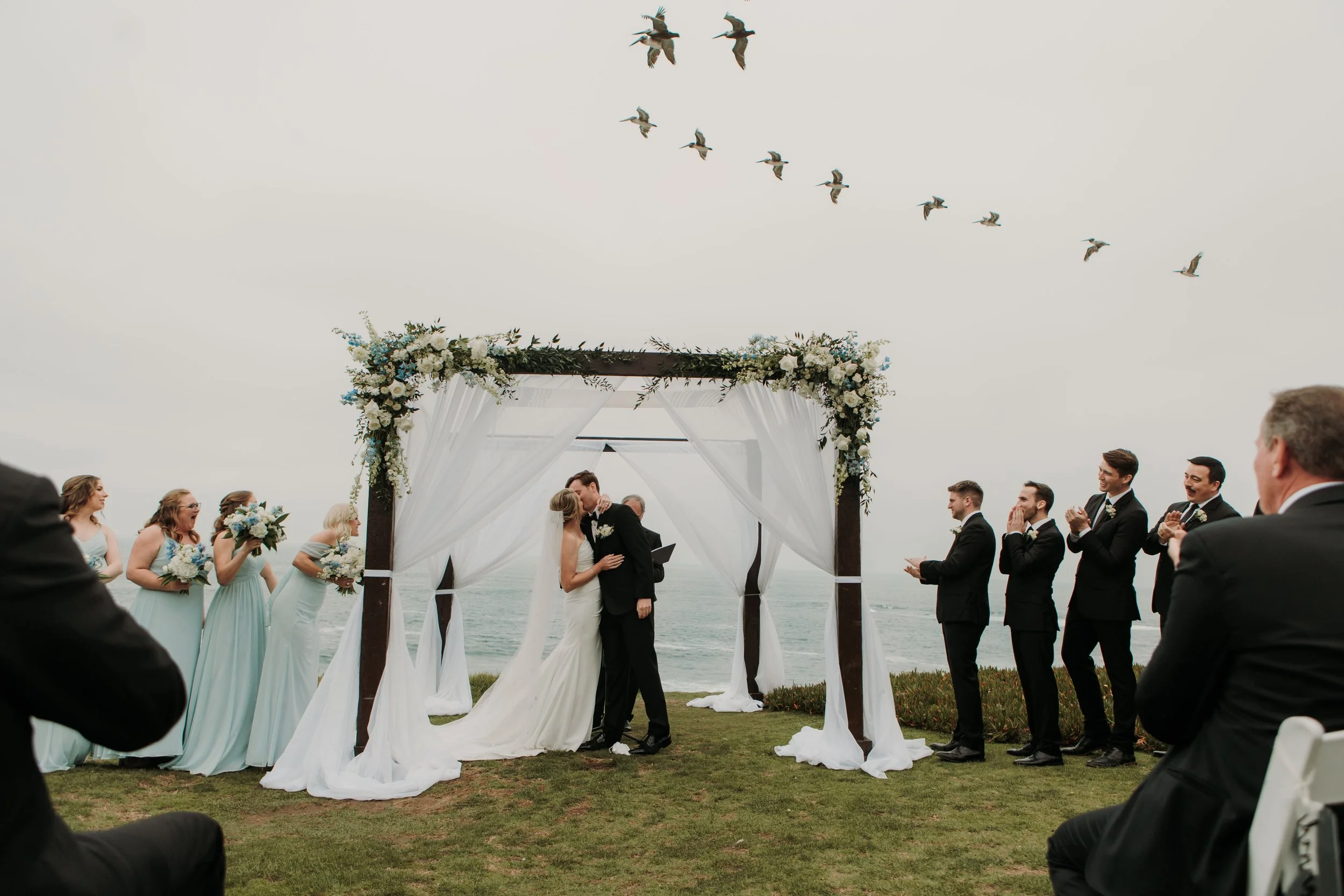 Candid photos of a wedding at The Wedding Bowl and Cuvier Club in La Jolla. San Diego wedding photography by Indigo West Photography.