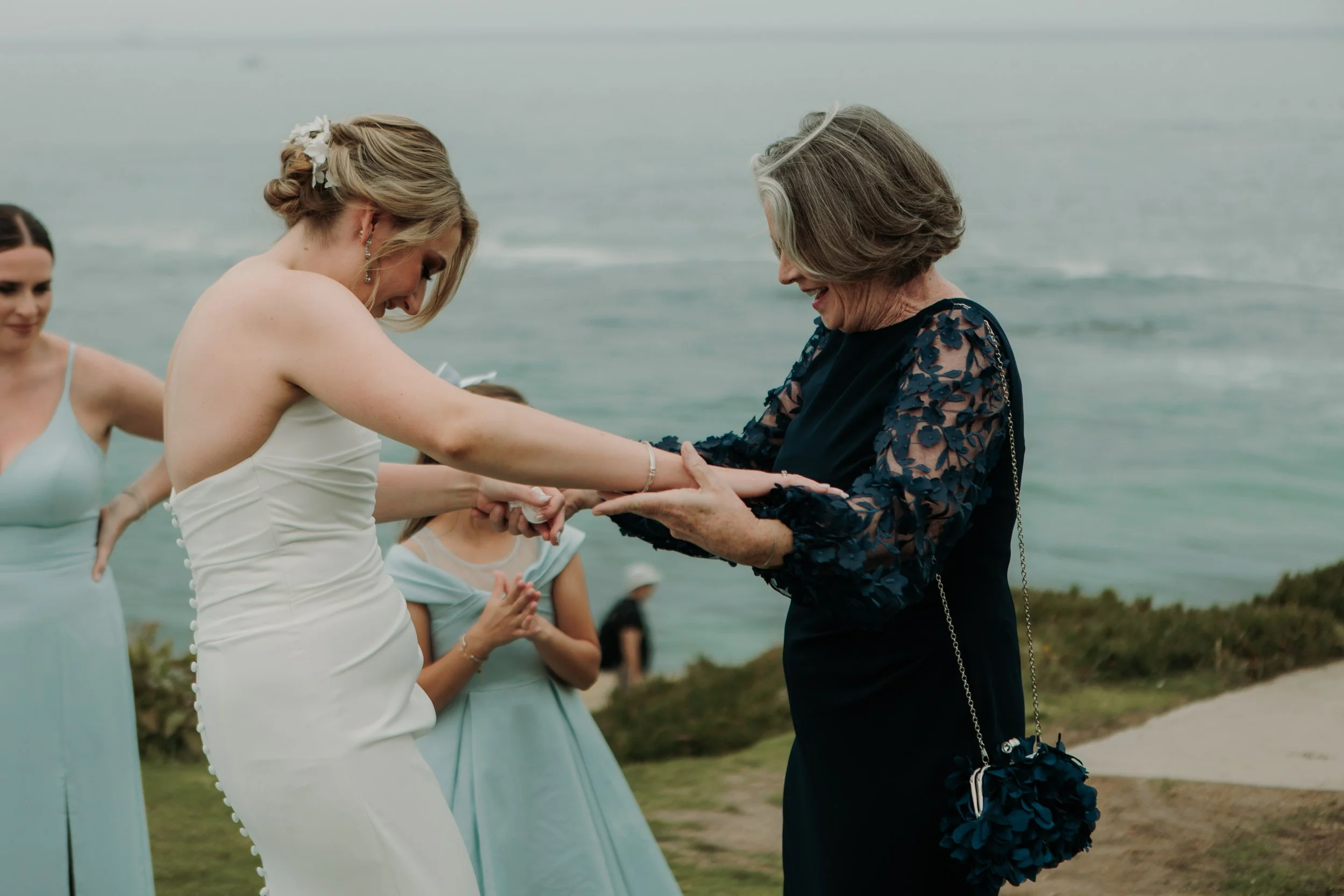 Candid photos of a wedding at The Wedding Bowl and Cuvier Club in La Jolla. San Diego wedding photography by Indigo West Photography.