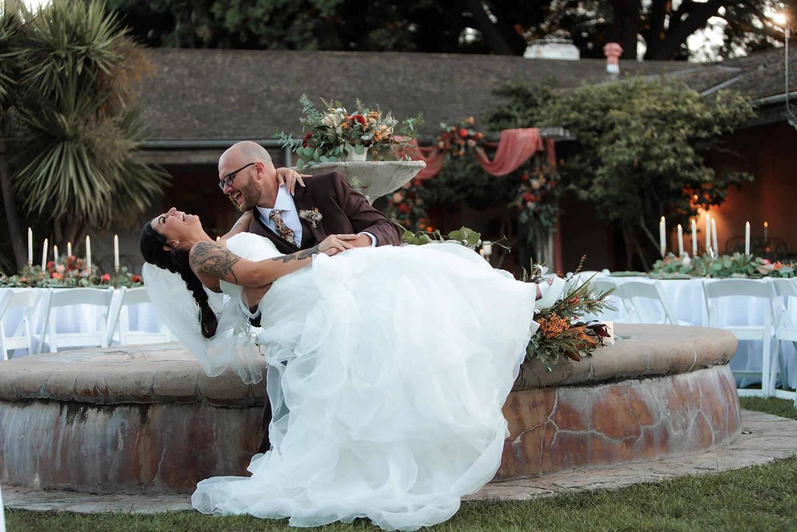San Diego wedding photography, couple sits on a fountain.
