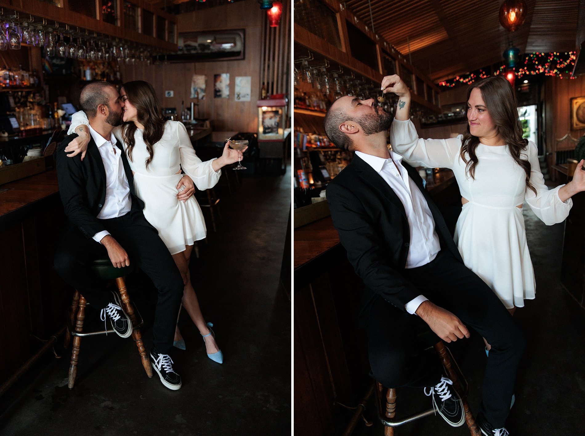 San Diego engagement shot in a bar, they have drinks together and she feeds him an olive.