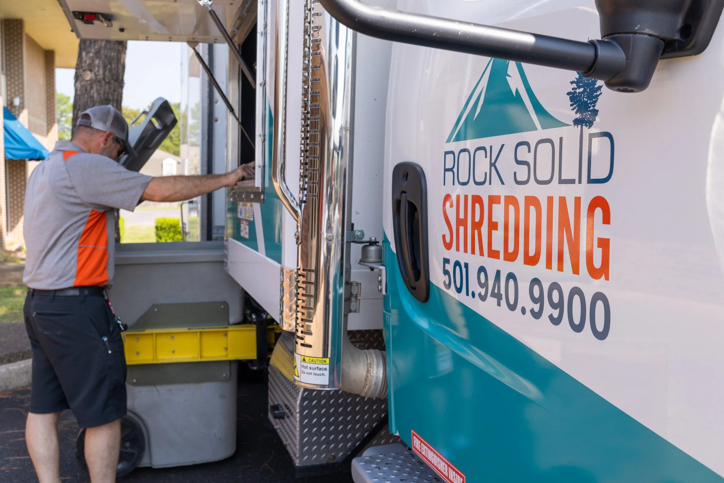 man shredding paper