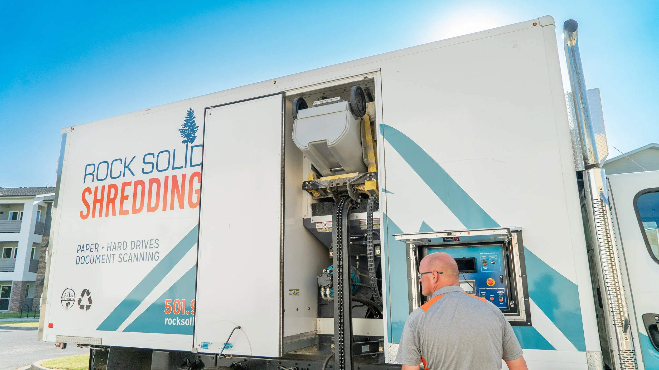 Rock Solid Shredding employee operating a mobile paper shredding vehicle