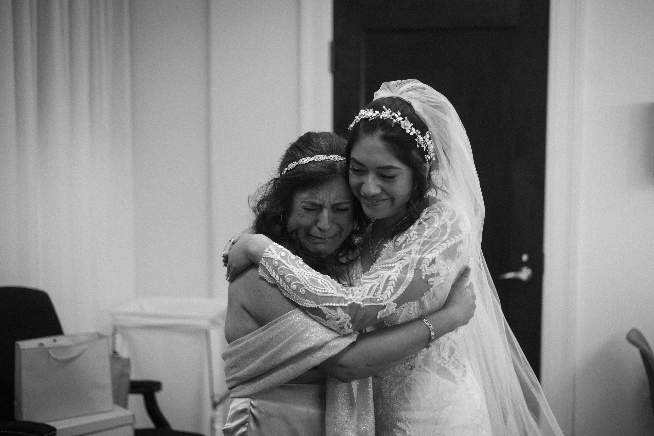 Bride and Mother sharing a moment during a Bloomington. Wedding.