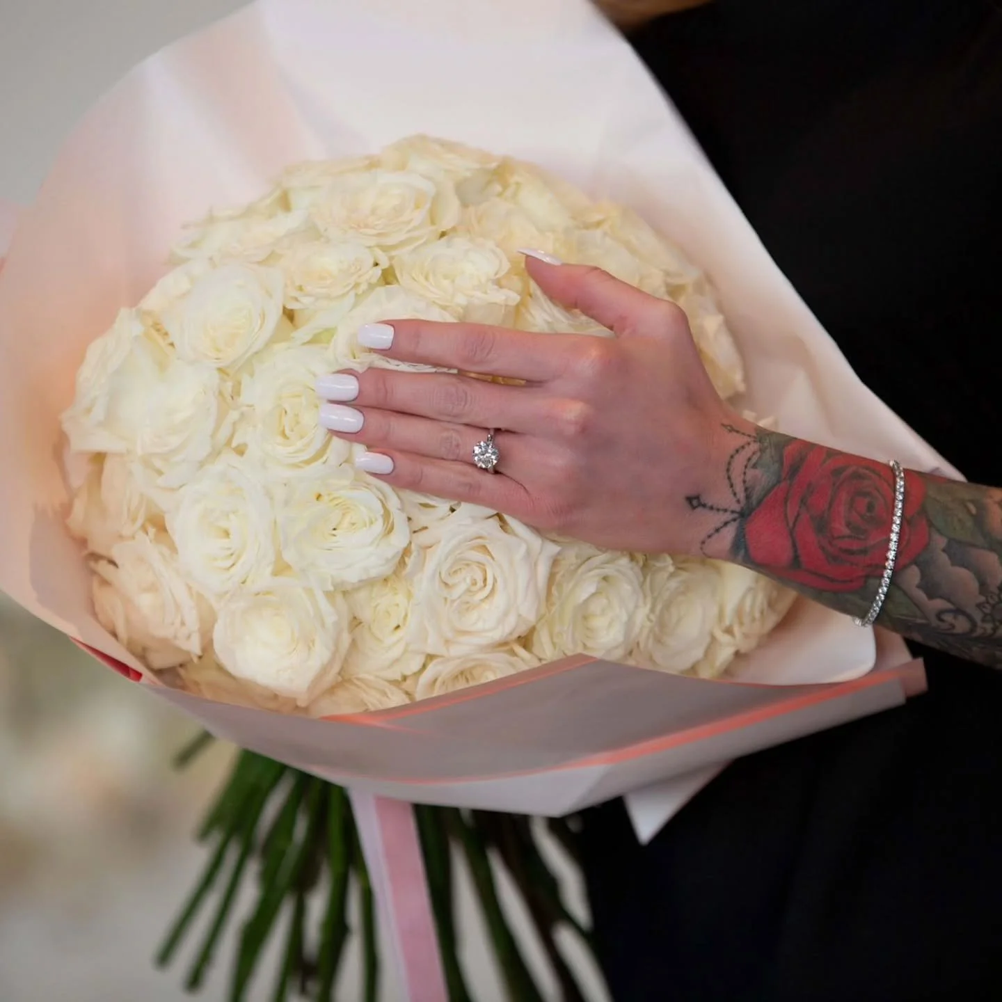 She said YES!

Surrounded by love and 60 perfect white roses, this moment was nothing short of magical. From the sparkle of the ring to the glow in her smile&mdash;this engagement is one for the books.

Here's to forever starting with a single rose..