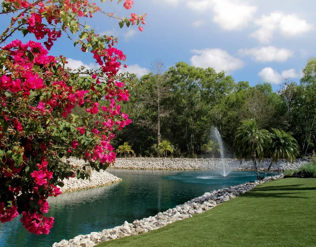 Located at Corkscrew Weddings and Winery, the Ceremony Circle is a picturesque outdoor wedding site featuring tropical greenery, fountain views, and a peaceful natural backdrop ideal for ceremonies in Southwest Florida.