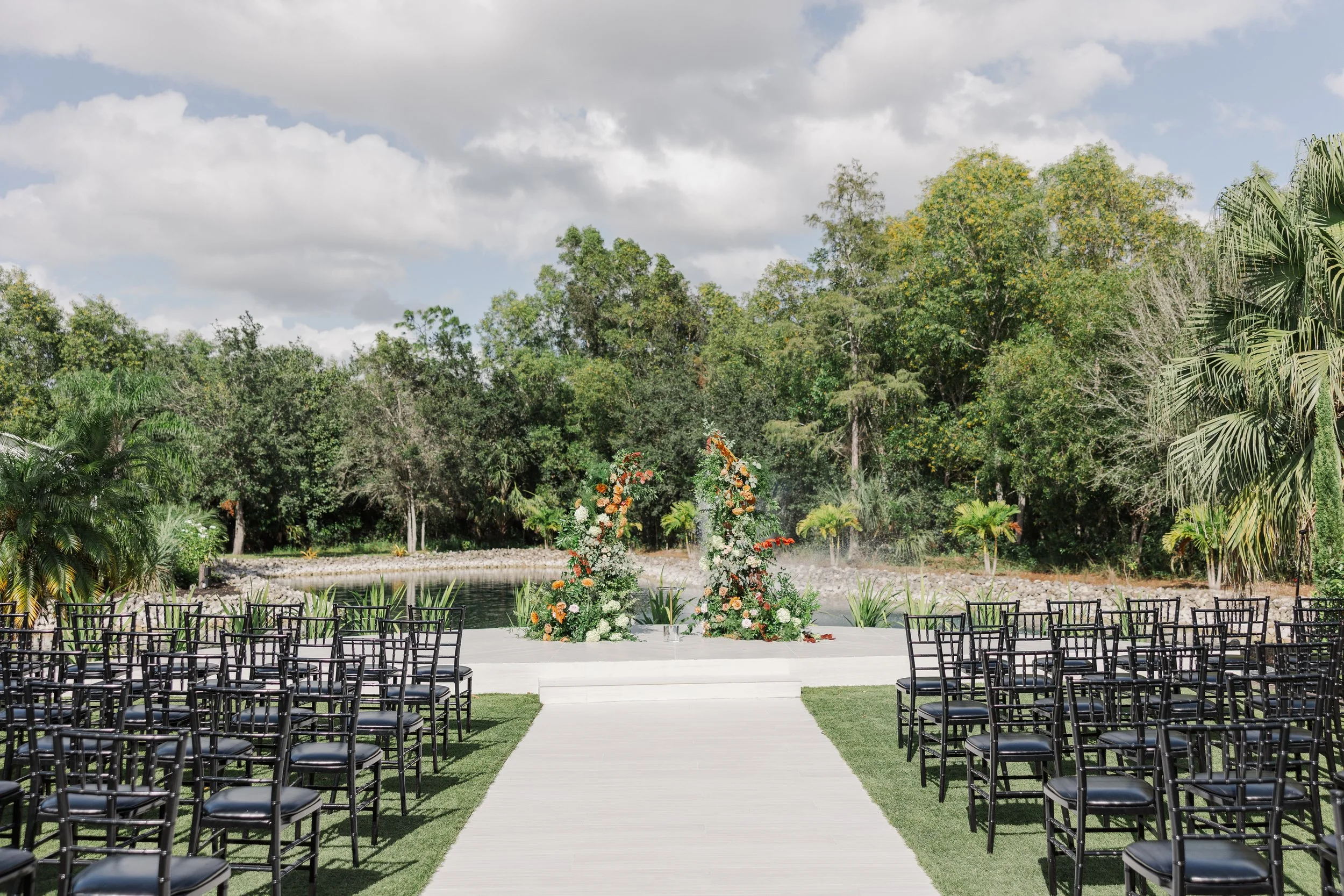 Located at Corkscrew Weddings and Winery, the Ceremony Circle is a picturesque outdoor wedding site featuring tropical greenery, fountain views, and a peaceful natural backdrop ideal for ceremonies in Southwest Florida.