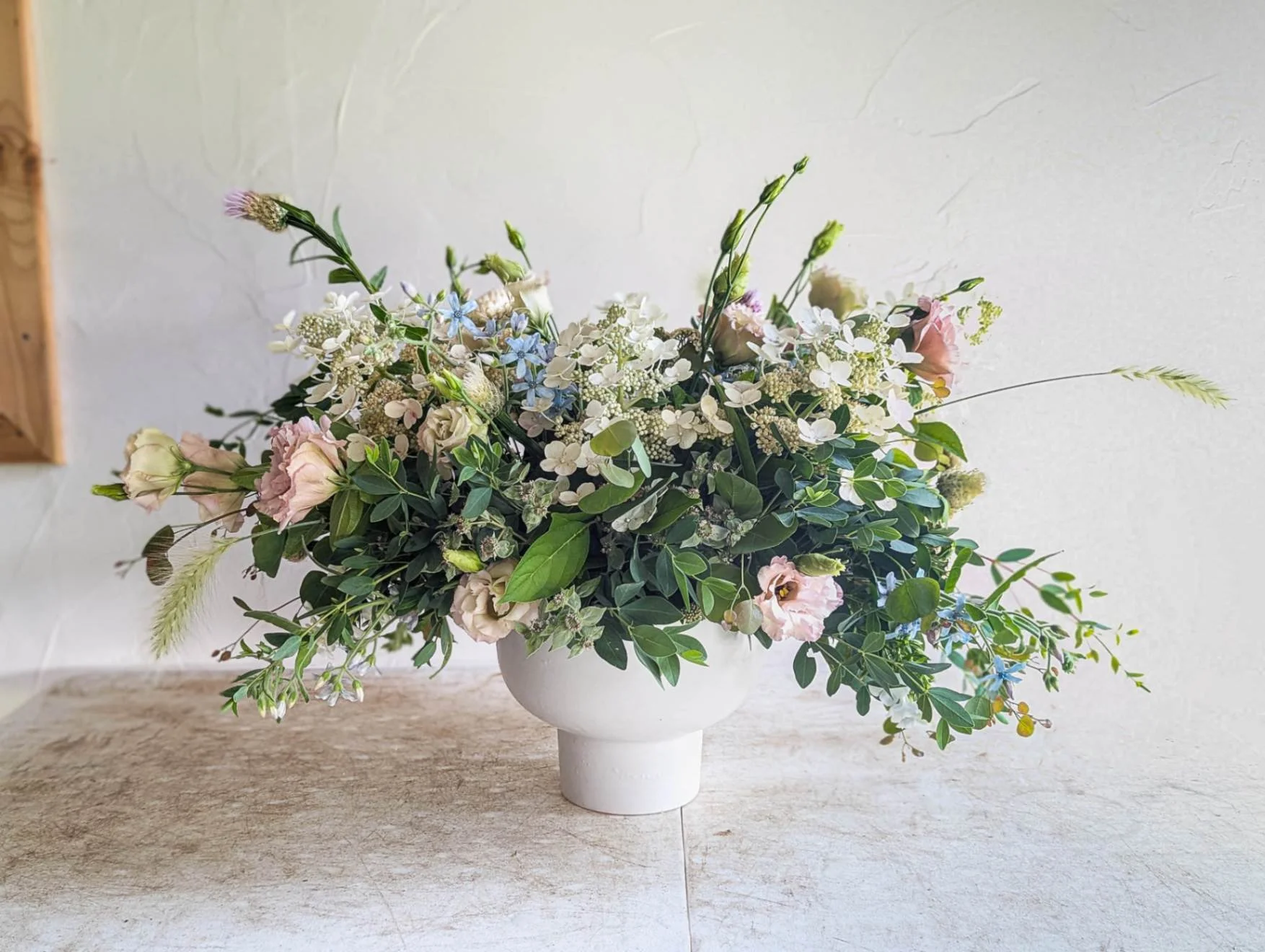 Spring arrangement in white compote designed by Love n' Fresh Flowers
