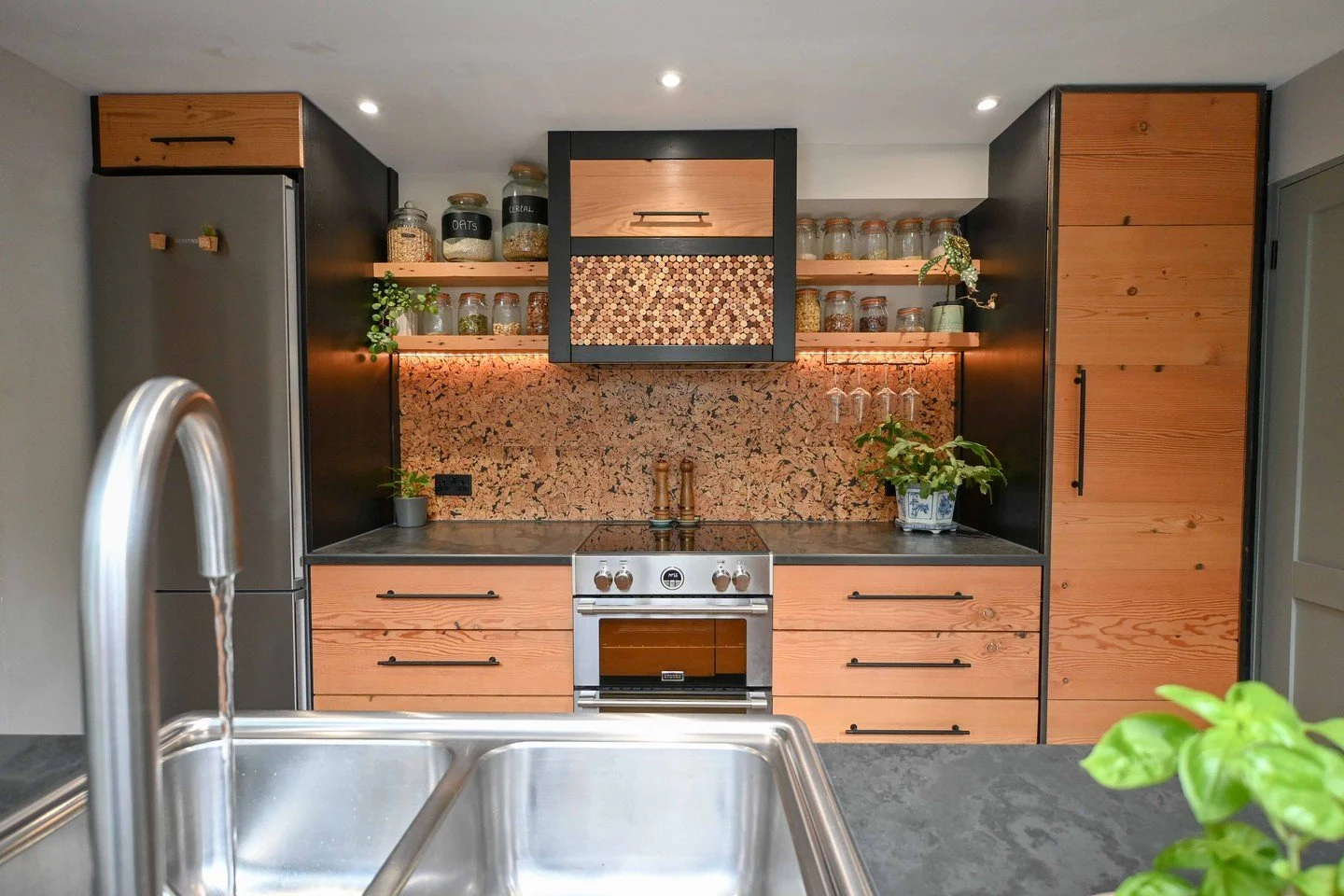 Recently finished reclaimed Douglas Fir galley kitchen in Totnes, complete with natural slate worktops, a cork splash back and feature panel on the hood. What once felt like a small space is transformed into a relaxing environment with lots of clever