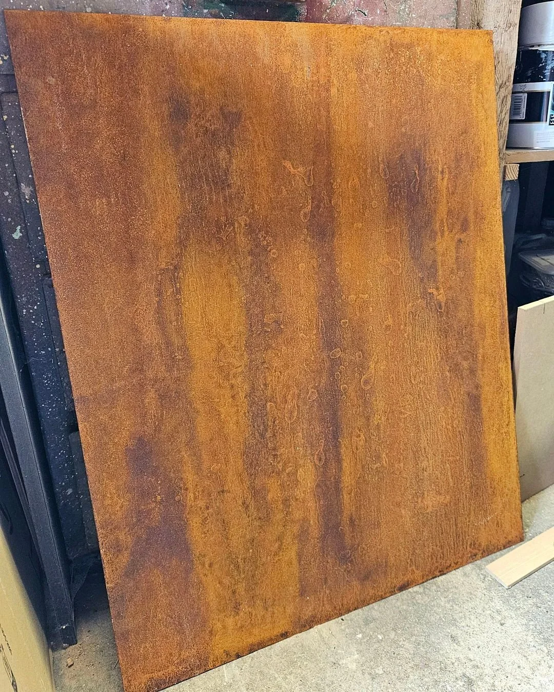 Naturally rusted steel, using a dash of salt to speed up the process and laquered to preserve the patina. Ready to to be made up into some kitchen door fronts.