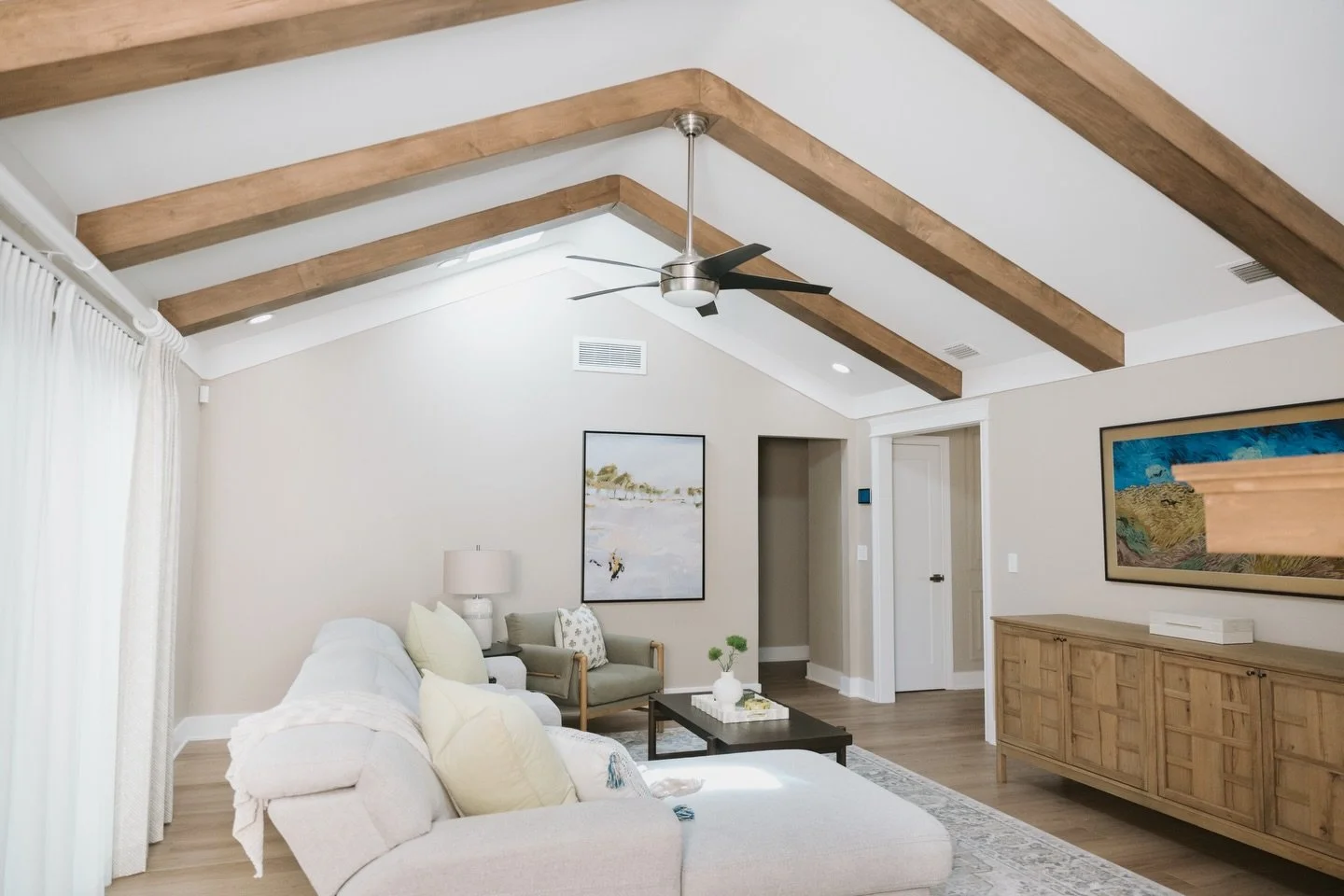 Sometimes a room doesn&rsquo;t need more furniture&hellip; it needs more architecture.

By introducing warm wood ceiling beams and flooring with richer tone and character, this space went from flat and builder-basic to layered and inviting. #ACIxSWEE