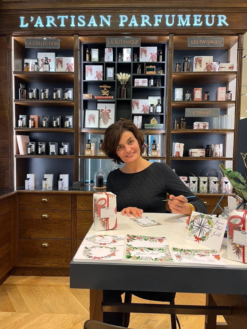Photo of Aurélie Salmon Lahad on location illustrating notecards at a French perfumery