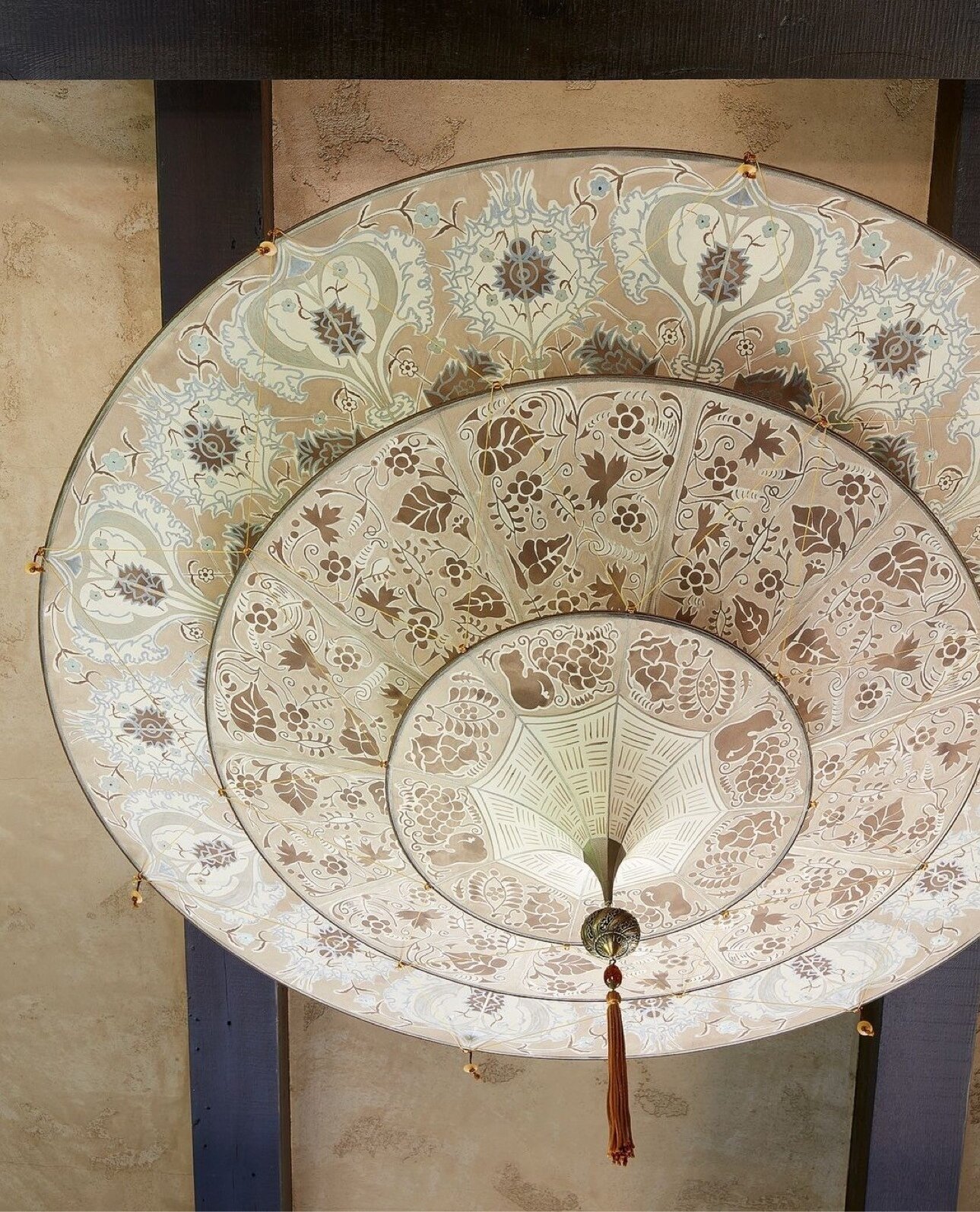 A Fortuny silk Scheherazade ceiling fixture that combines Mariano Fortuny&rsquo;s love for both the Venetian and the Oriental. The 3-tier structure has the form of an upside-down pagoda and is suspended by a delicate net of cords decorated with Muran