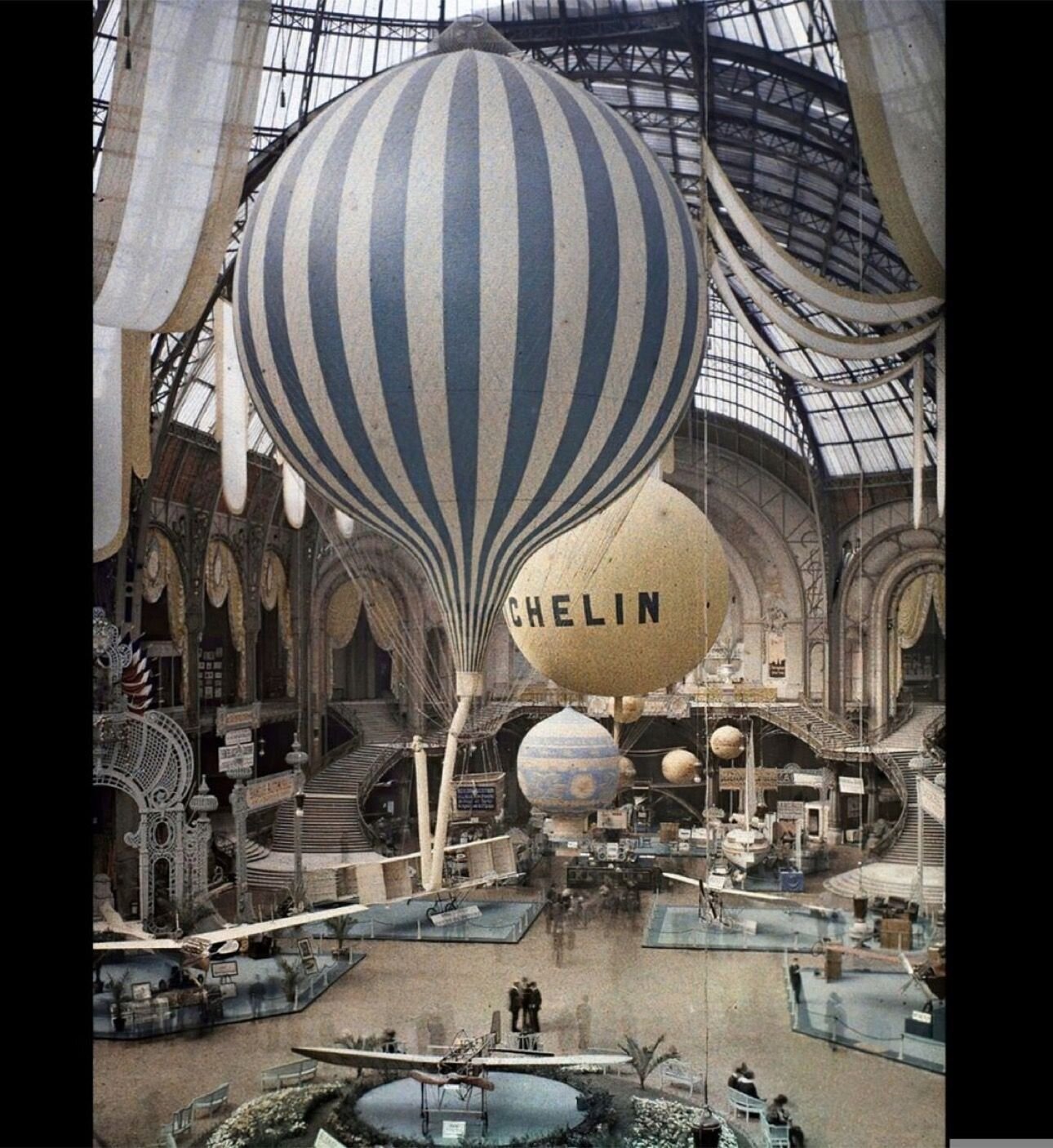 Autochrome Lumiere image of hot air balloons on display at the Grand Palais in Paris, France in original color, 1914.⁠
⁠
Auguste and Louis Lumi&egrave;re invented the Autochrome, a positive color transparency on glass, in 1907 and manufactured it unt