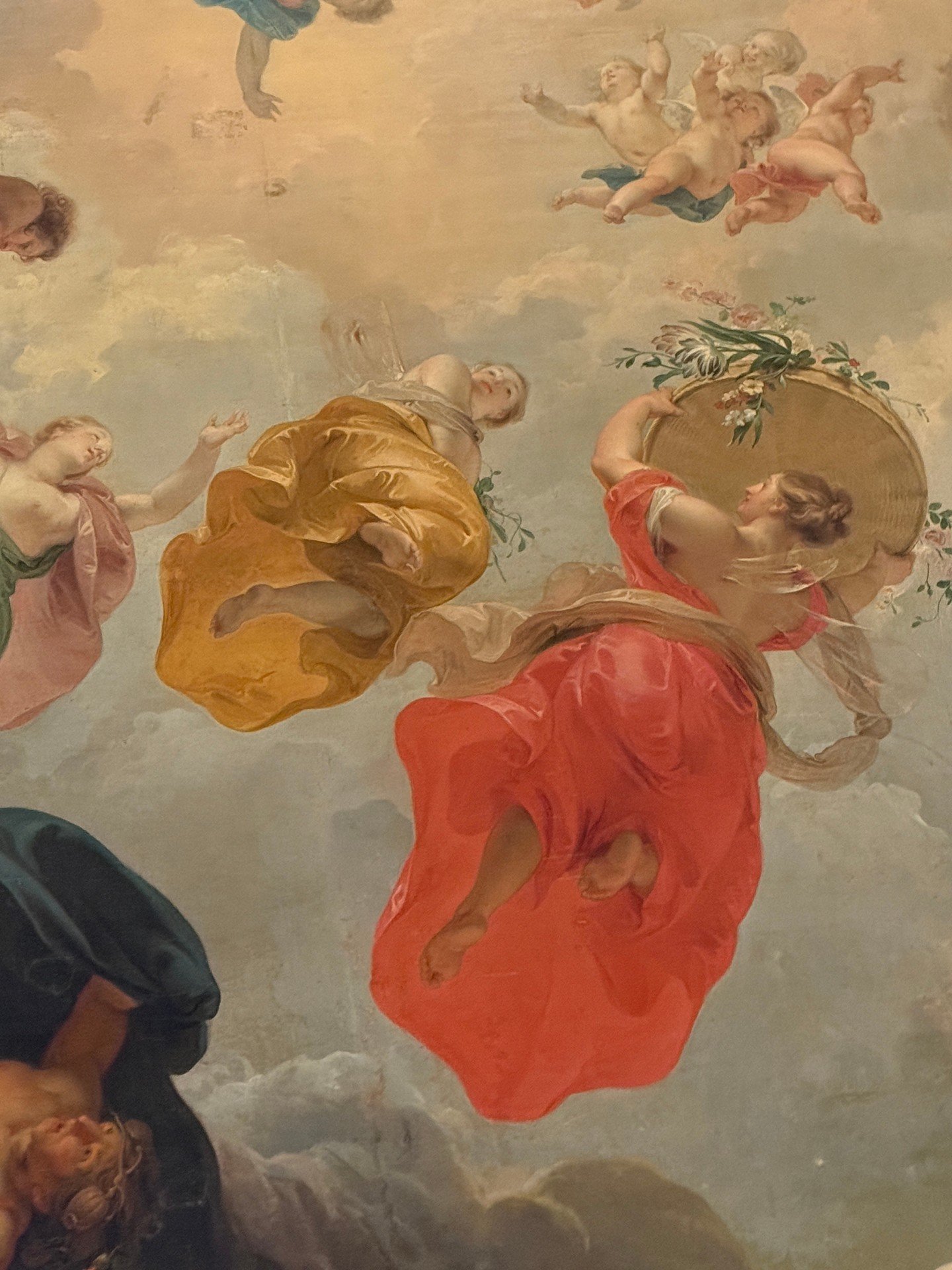 Flora! Detail of an 18th-century painting called "Dawn," by Dutch artist Jacob de Witt. The woman in the red dress, holding flowers, is Flora, the Roman goddess of Spring.⁠
⁠
The painting is from an 18th-century townhouse in Amsterdam and w