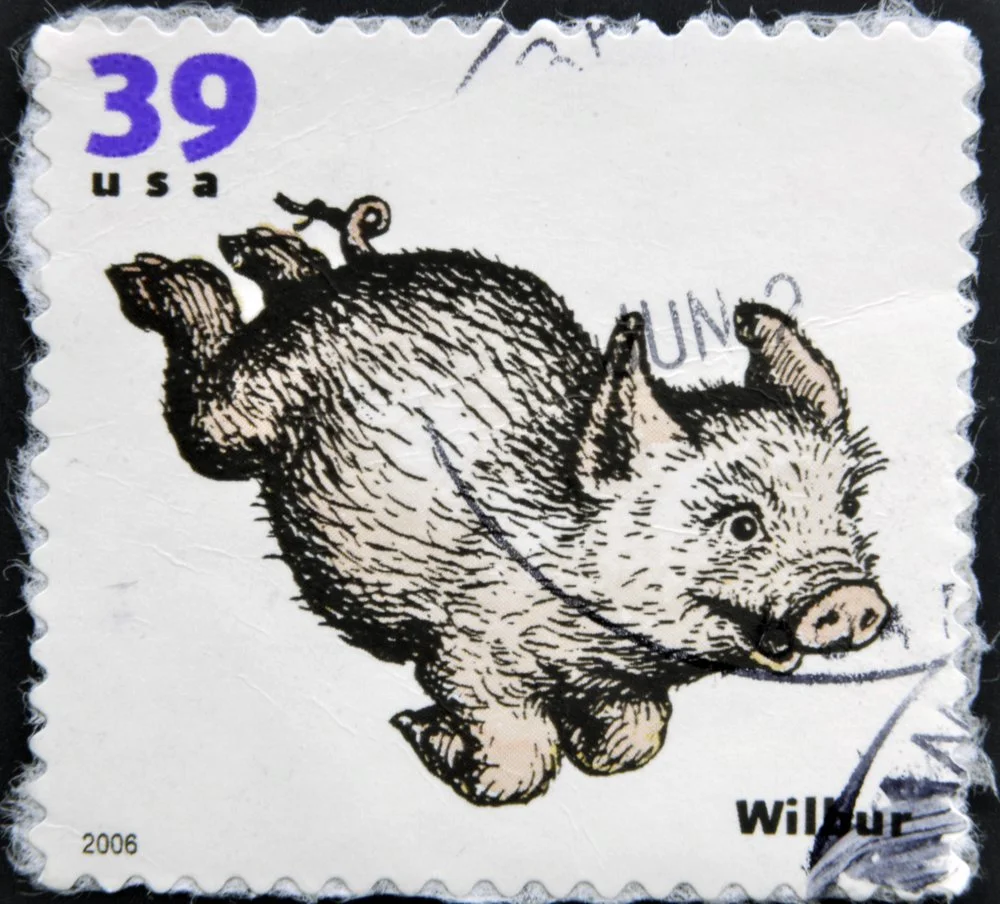 A 2006 stamp printed in USA featuring Wilbur the pig from E.B. White’s children’s novel, Charlotte’s Web. Image Source: Shutterstock