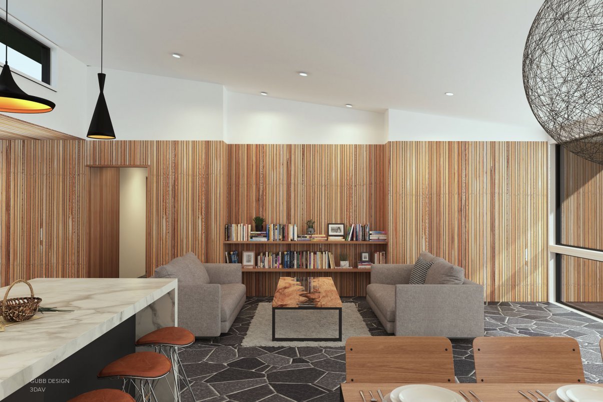Modern lounge space with two grey couches and bookshelves in background.