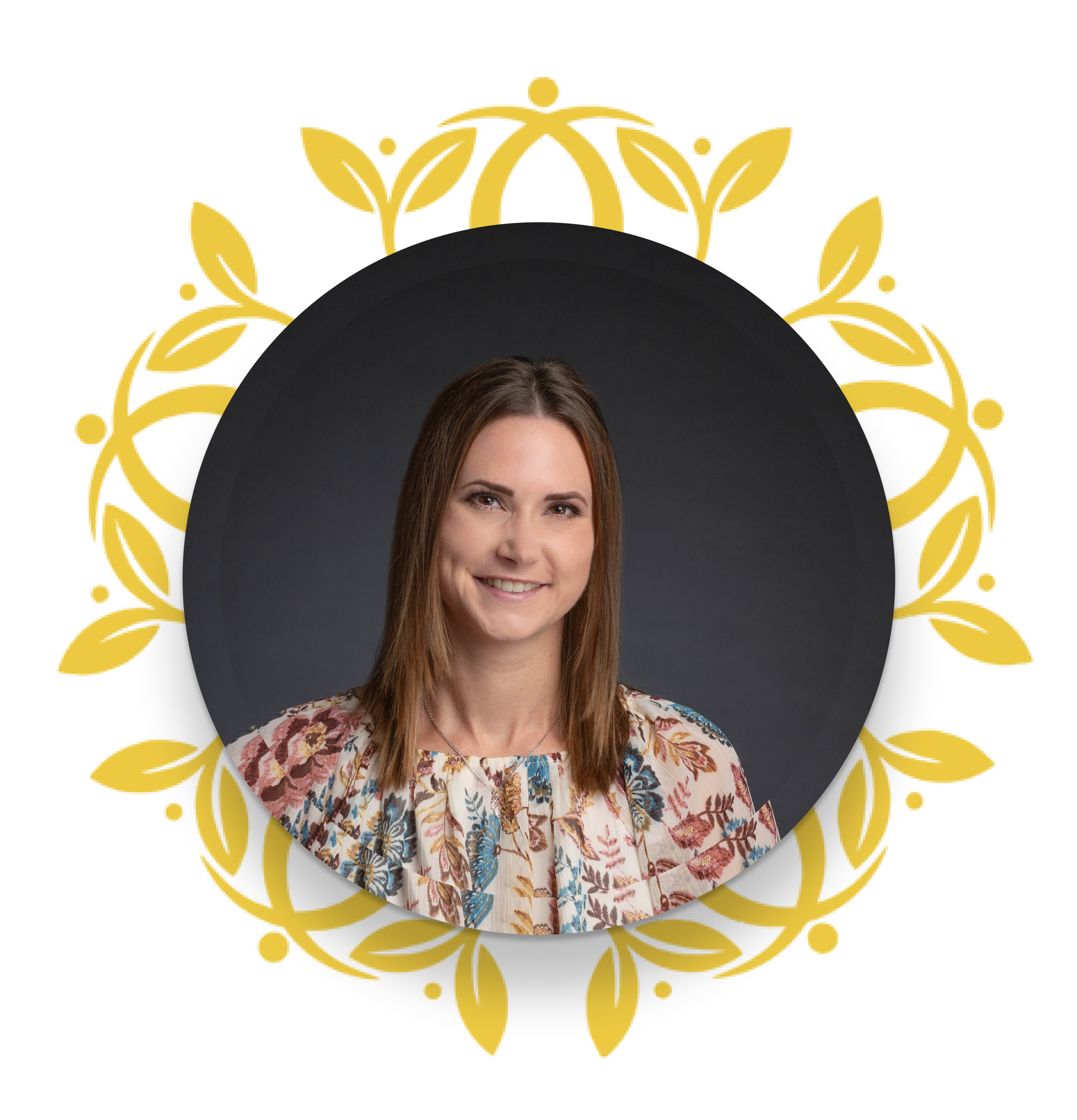 Portrait of a woman with shoulder-length brown hair, wearing a floral blouse, smiling against a dark gray background with a decorative gold leafy frame.