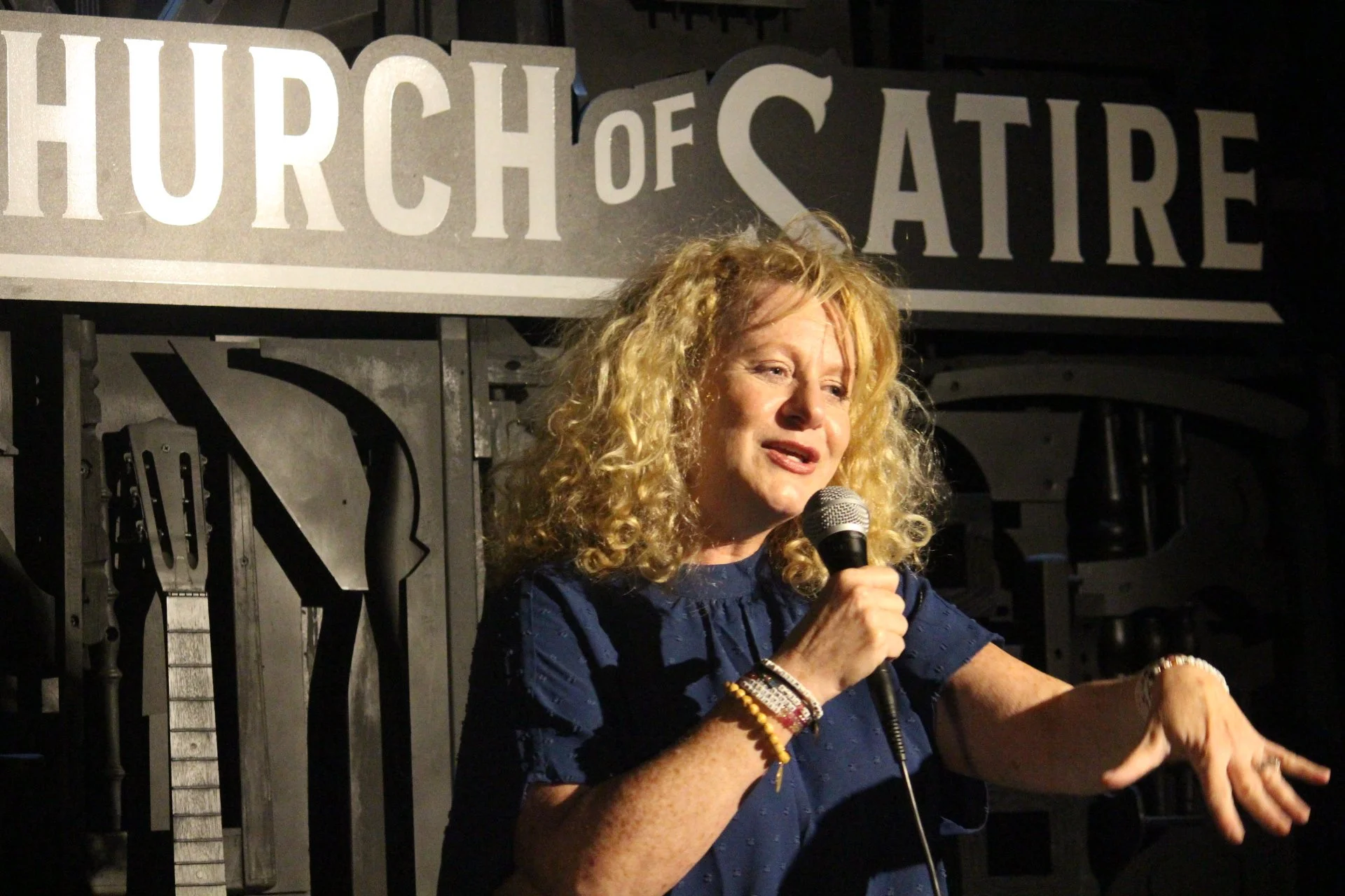 Comedian performing at Church of Satire venue