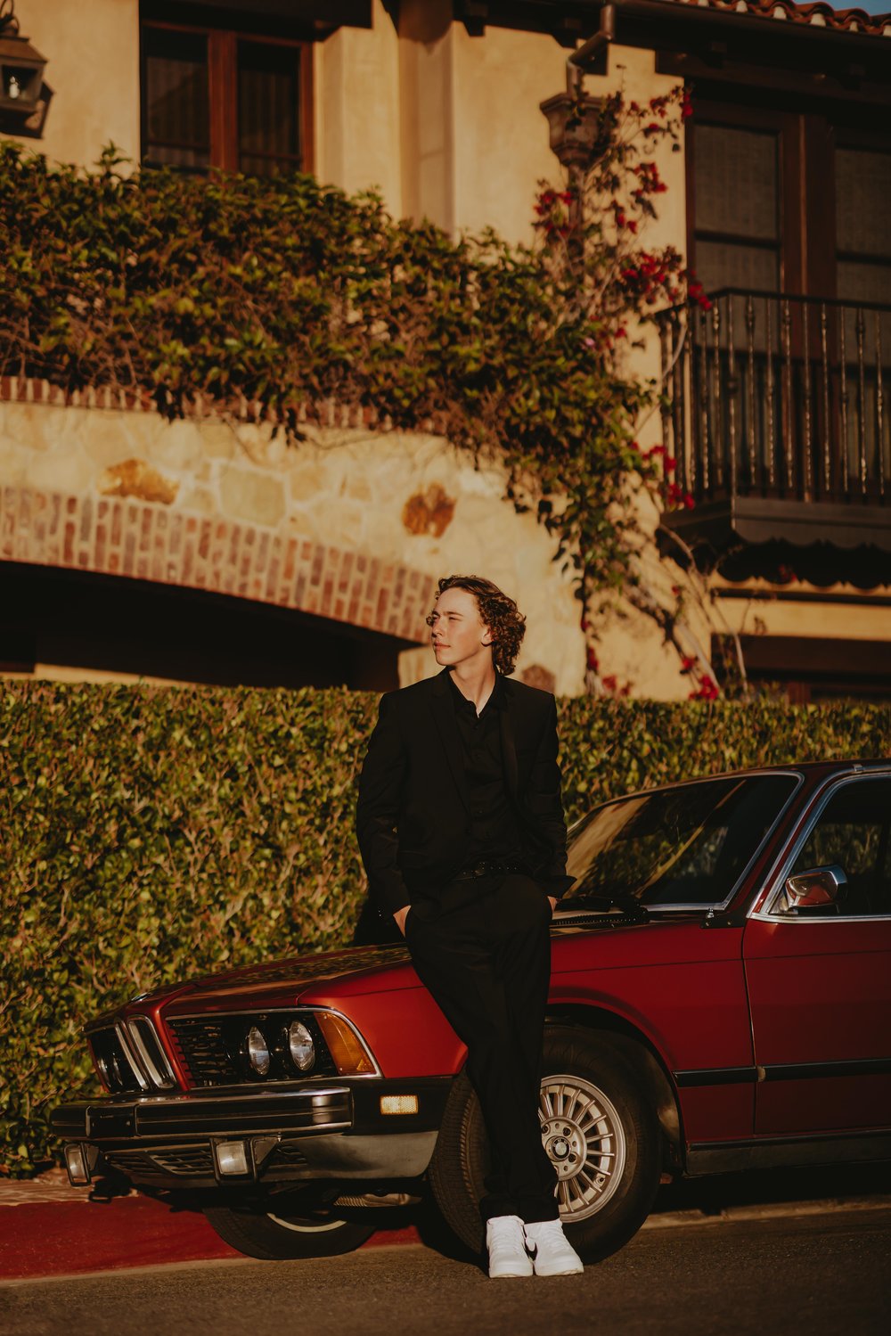  guy senior photo with classic car 