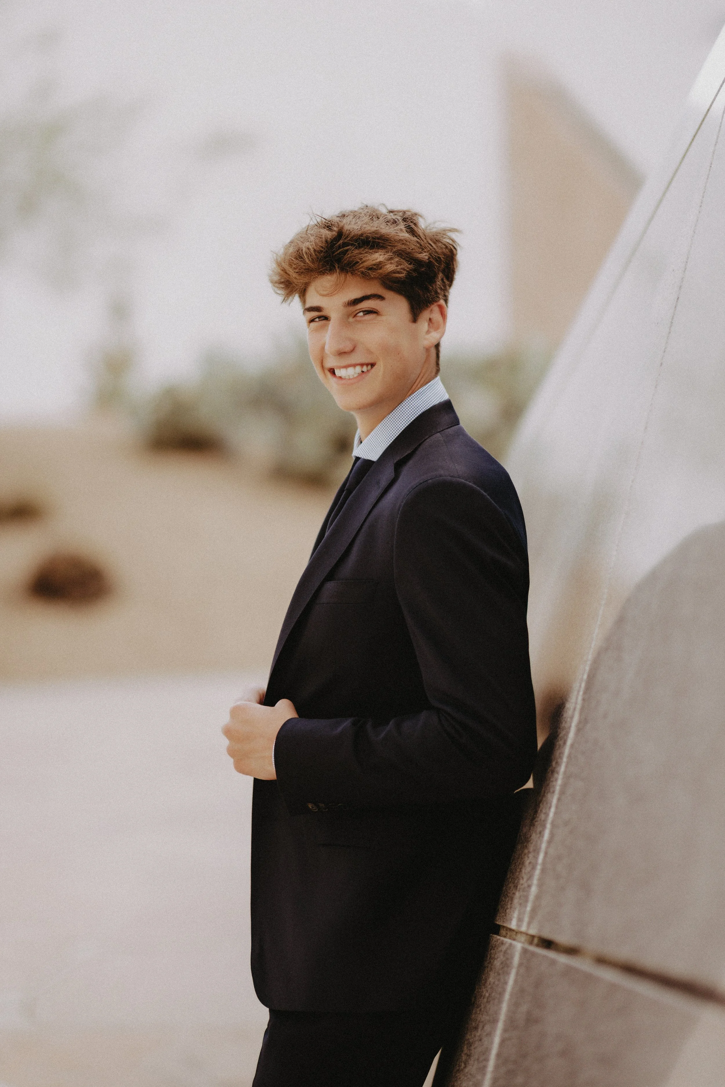  guy senior photos in a suit 